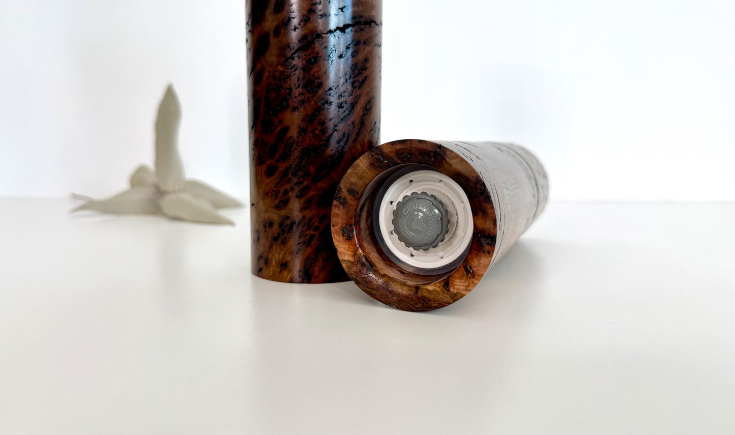 Bottom of salt and pepper grinder showing Crushgrind ceramic grinding mechanism and the adjustment knob