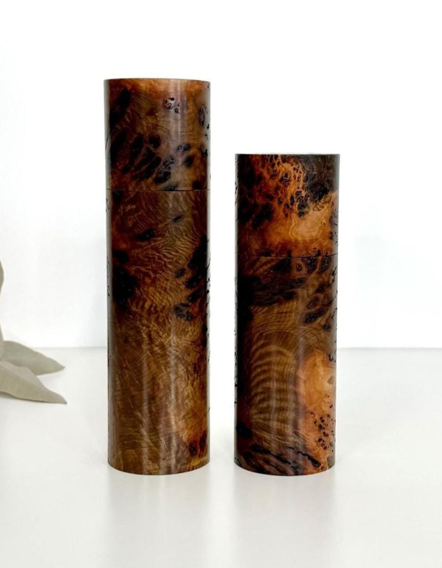 Wooden cylindrical shape salt and pepper grinders made from Gimlet burl timber