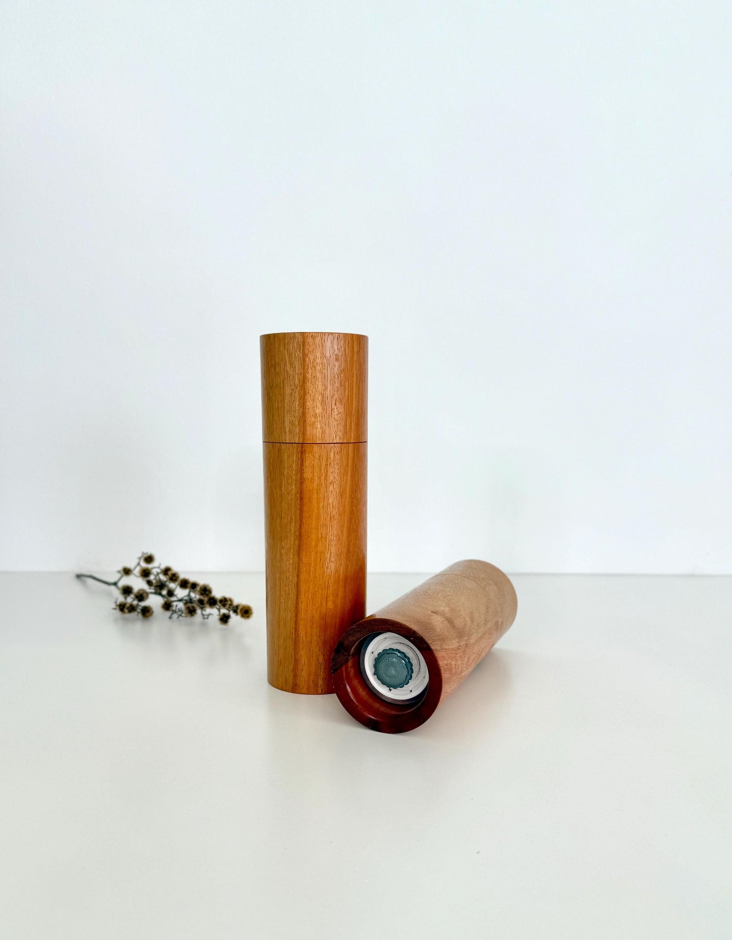 Bottom of salt and pepper grinder showing Crushgrind ceramic grinding mechanism and the adjustment knob