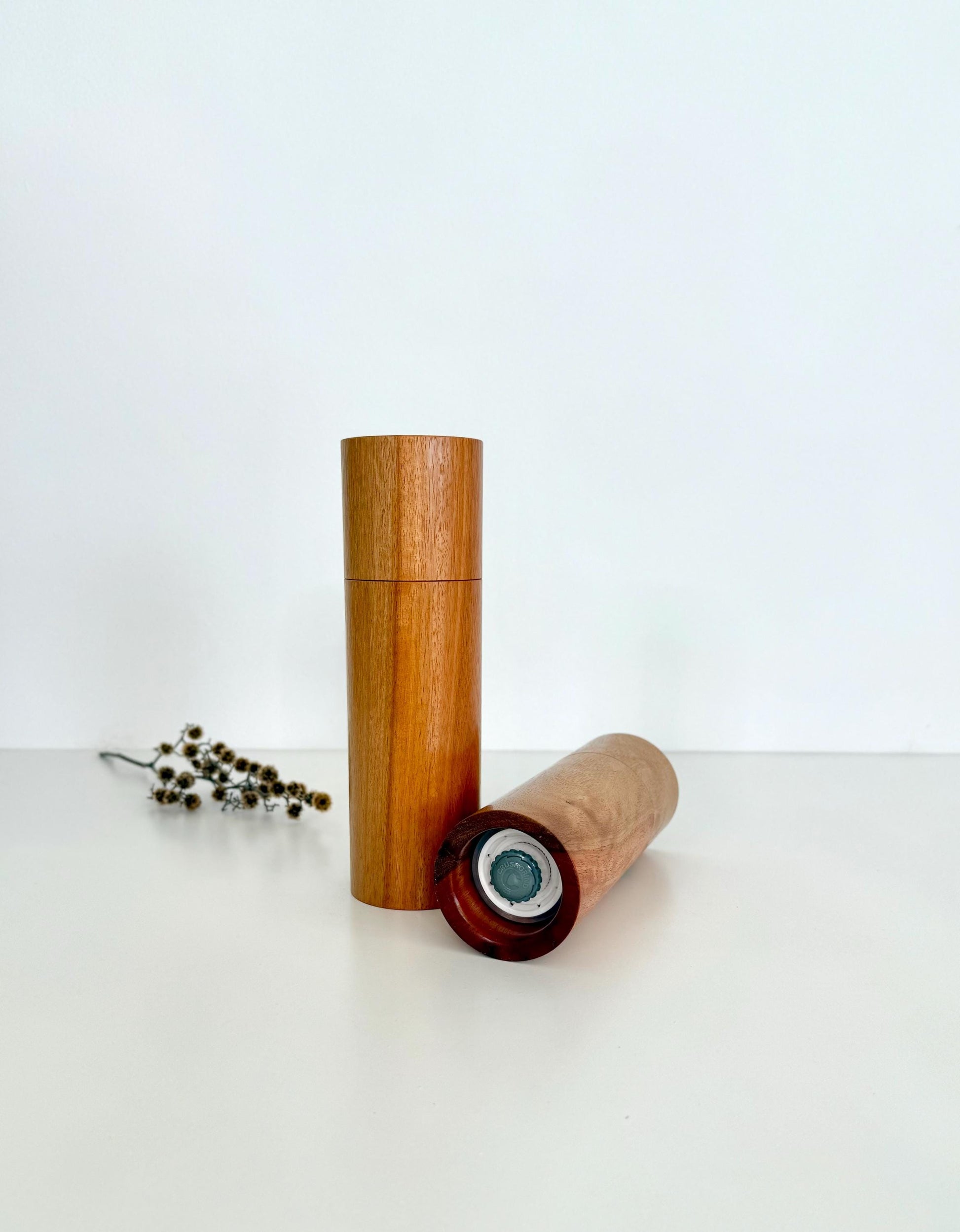 Bottom of salt and pepper grinder showing Crushgrind ceramic grinding mechanism and the adjustment knob