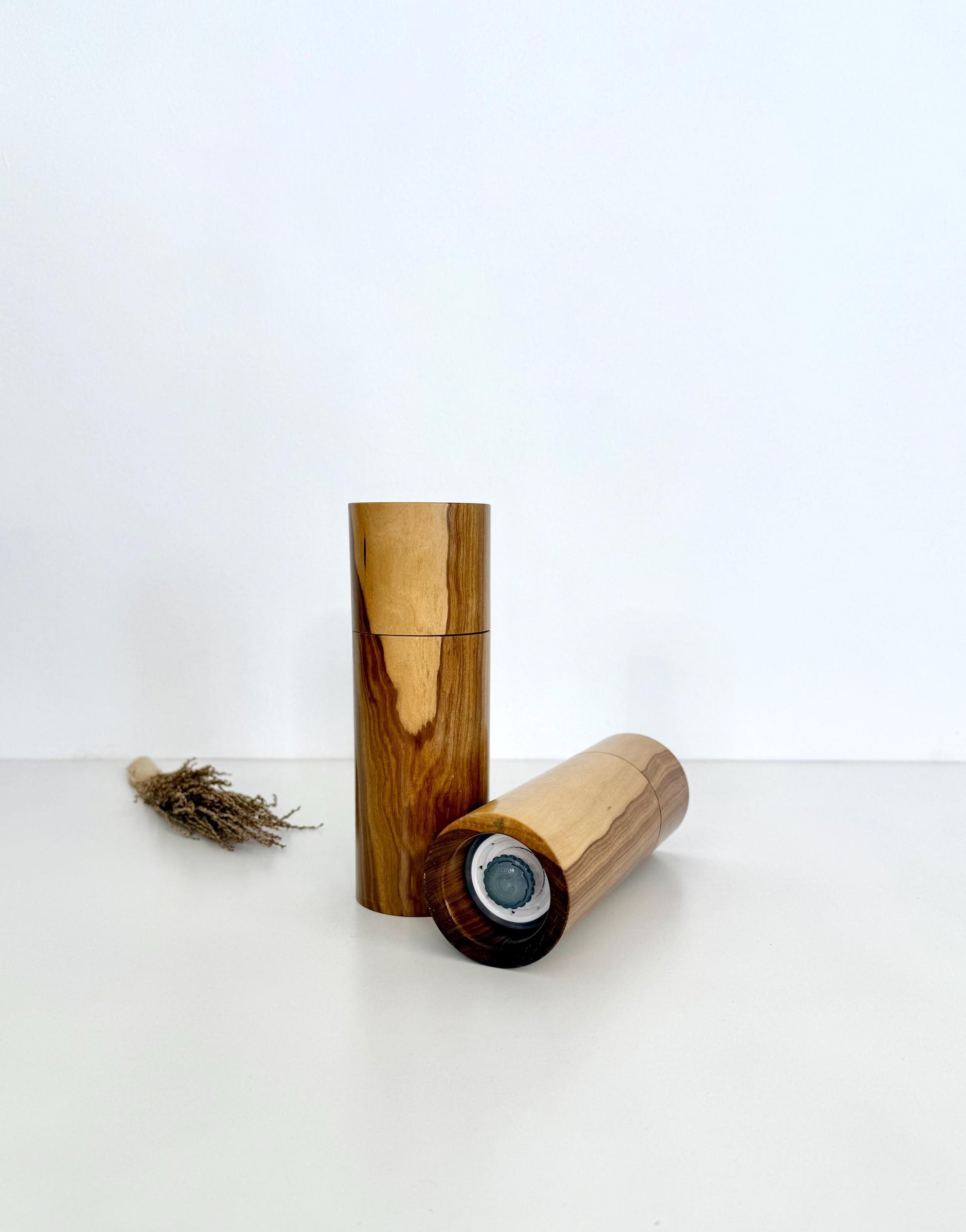 Bottom of salt and pepper grinder showing Crushgrind ceramic grinding mechanism and the adjustment knob