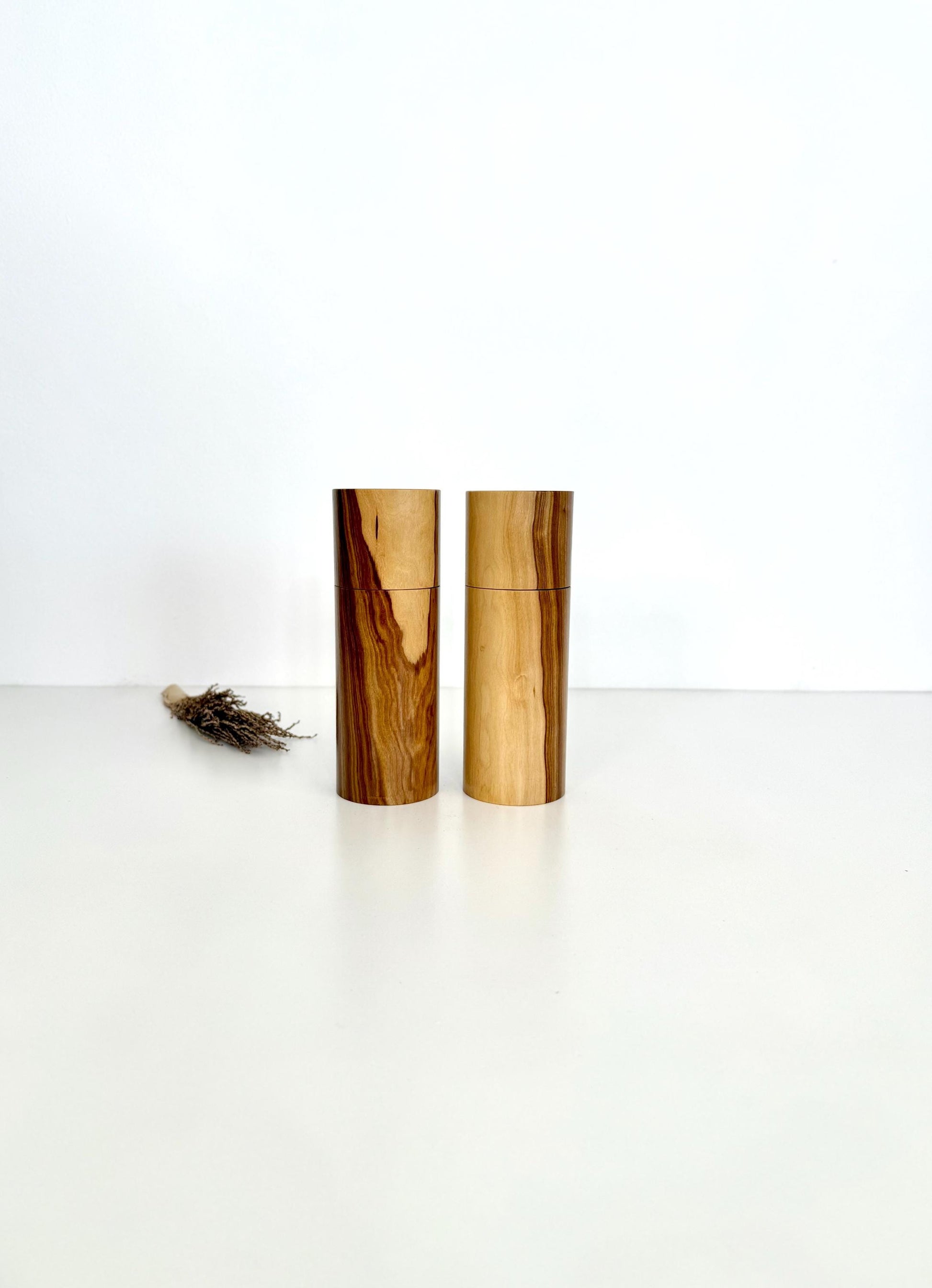 Wooden cylindrical shape salt and pepper grinders made from Rosewood timber