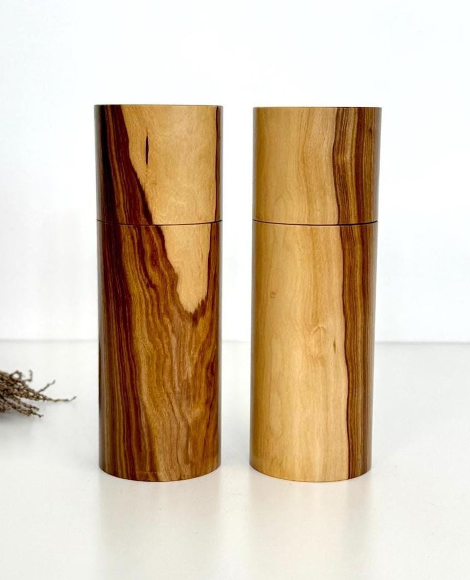 Wooden cylindrical shape salt and pepper grinders made from Buddha timber