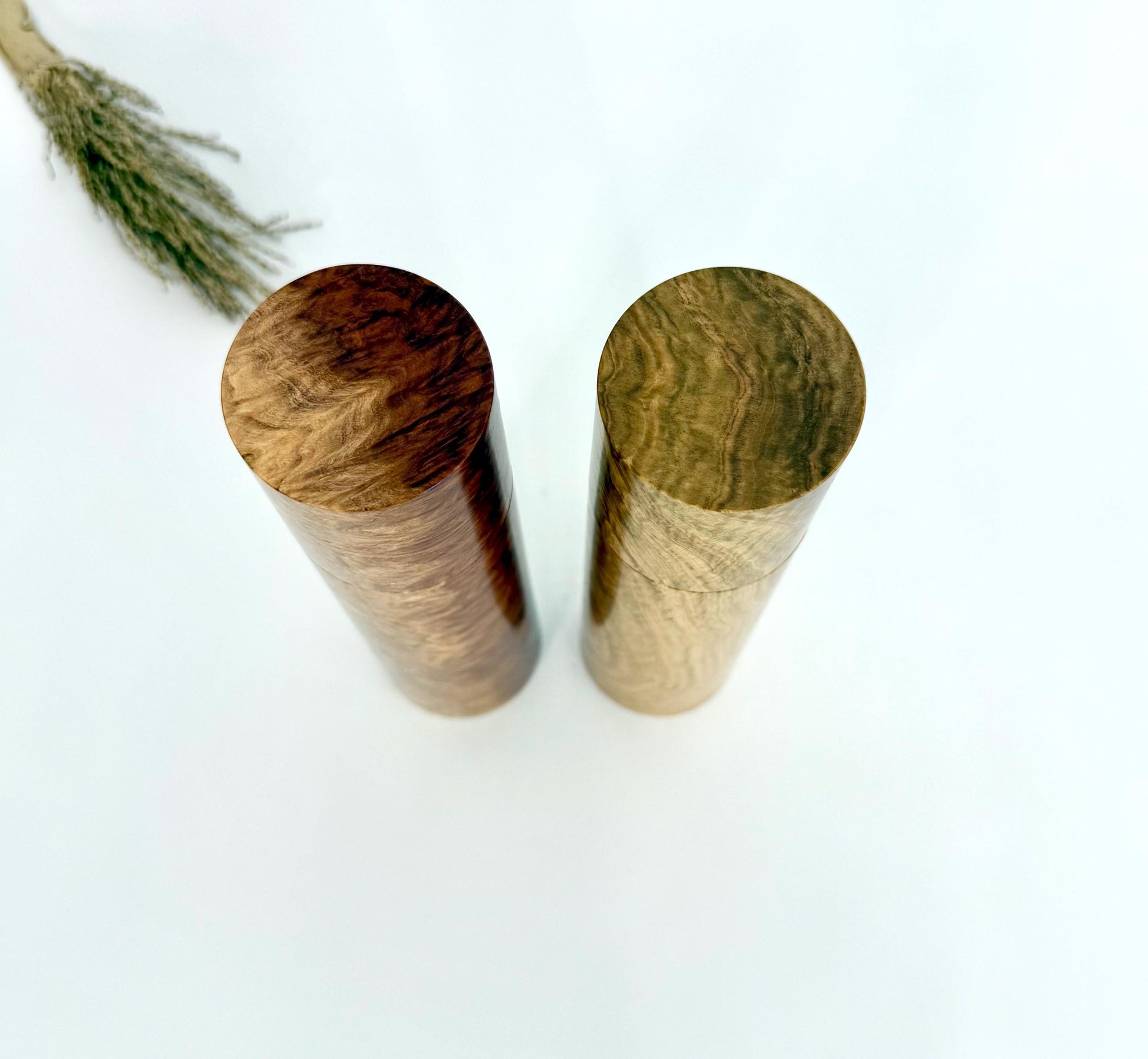 Birdseye view of wooden cylindrical shape salt and pepper grinders
