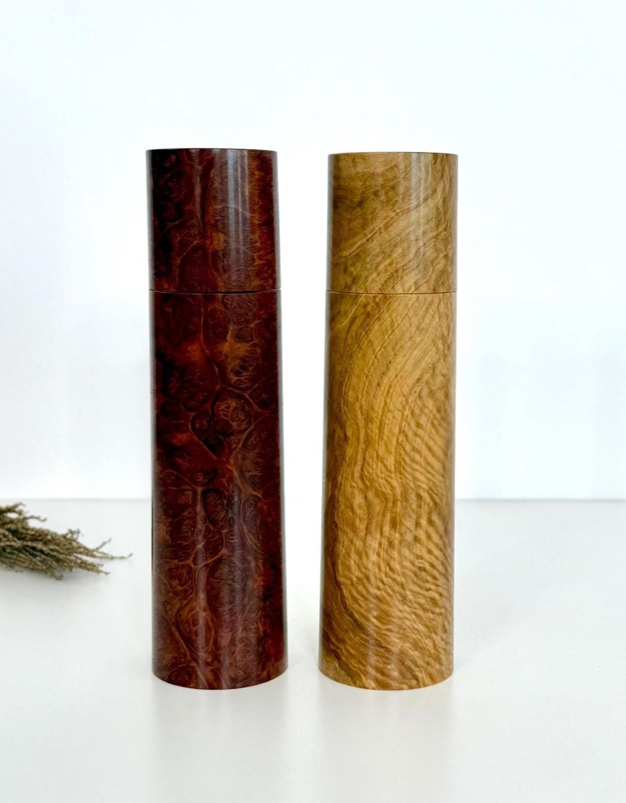 Wooden cylindrical shape salt and pepper grinders made from Red Mallee burl and Bimble Box burl timbers