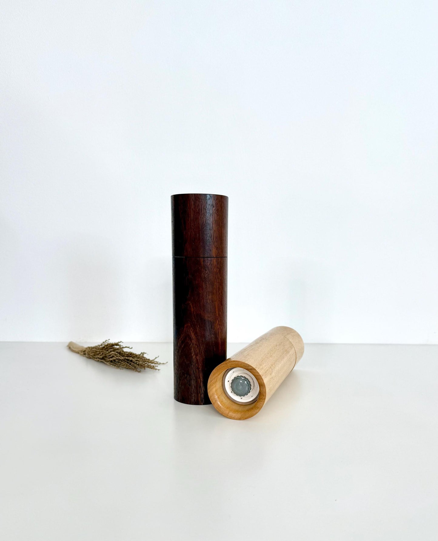 Bottom of salt and pepper grinder showing Crushgrind ceramic grinding mechanism and the adjustment knob