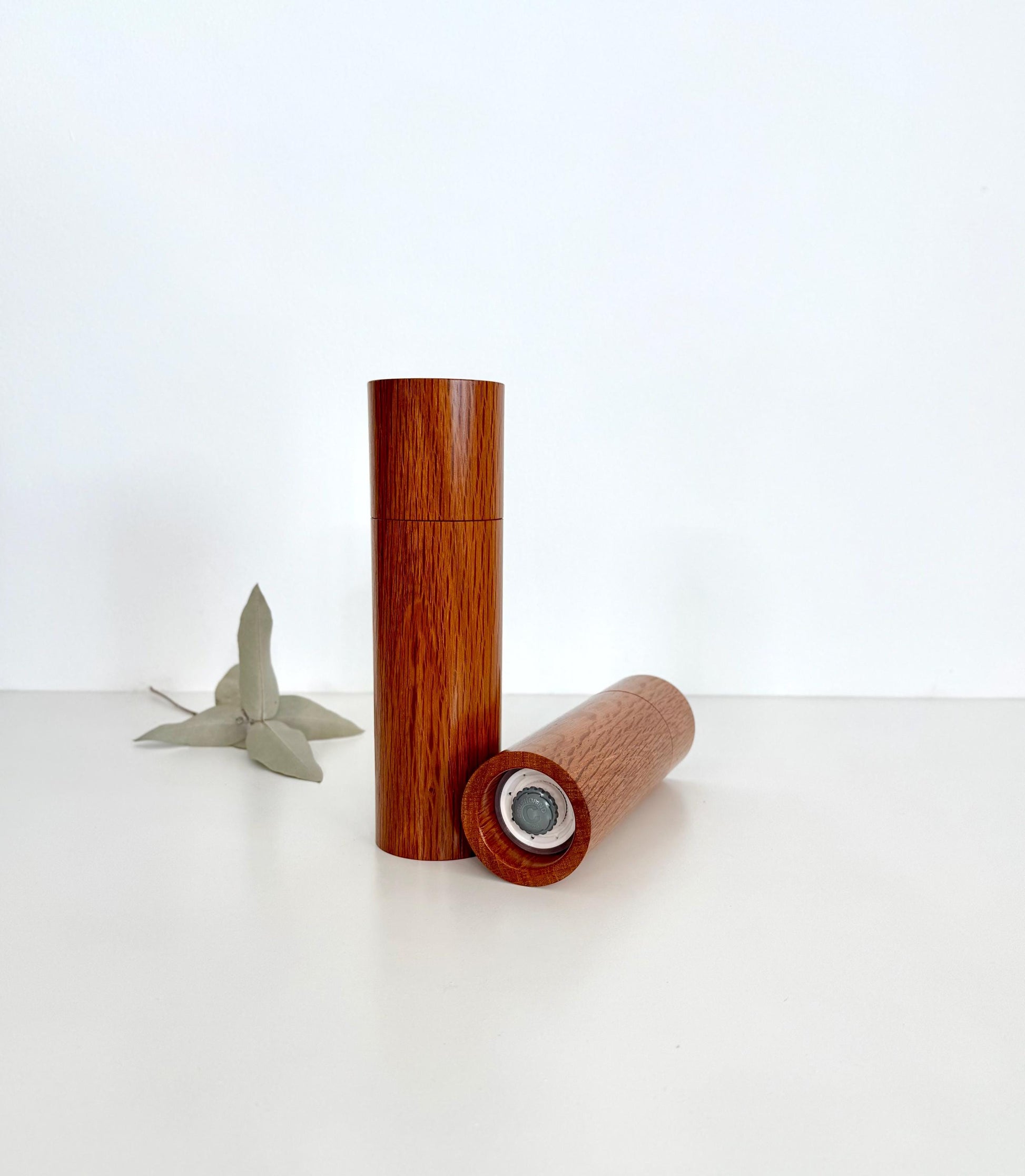 Bottom of salt and pepper grinder showing Crushgrind ceramic grinding mechanism and the adjustment knob