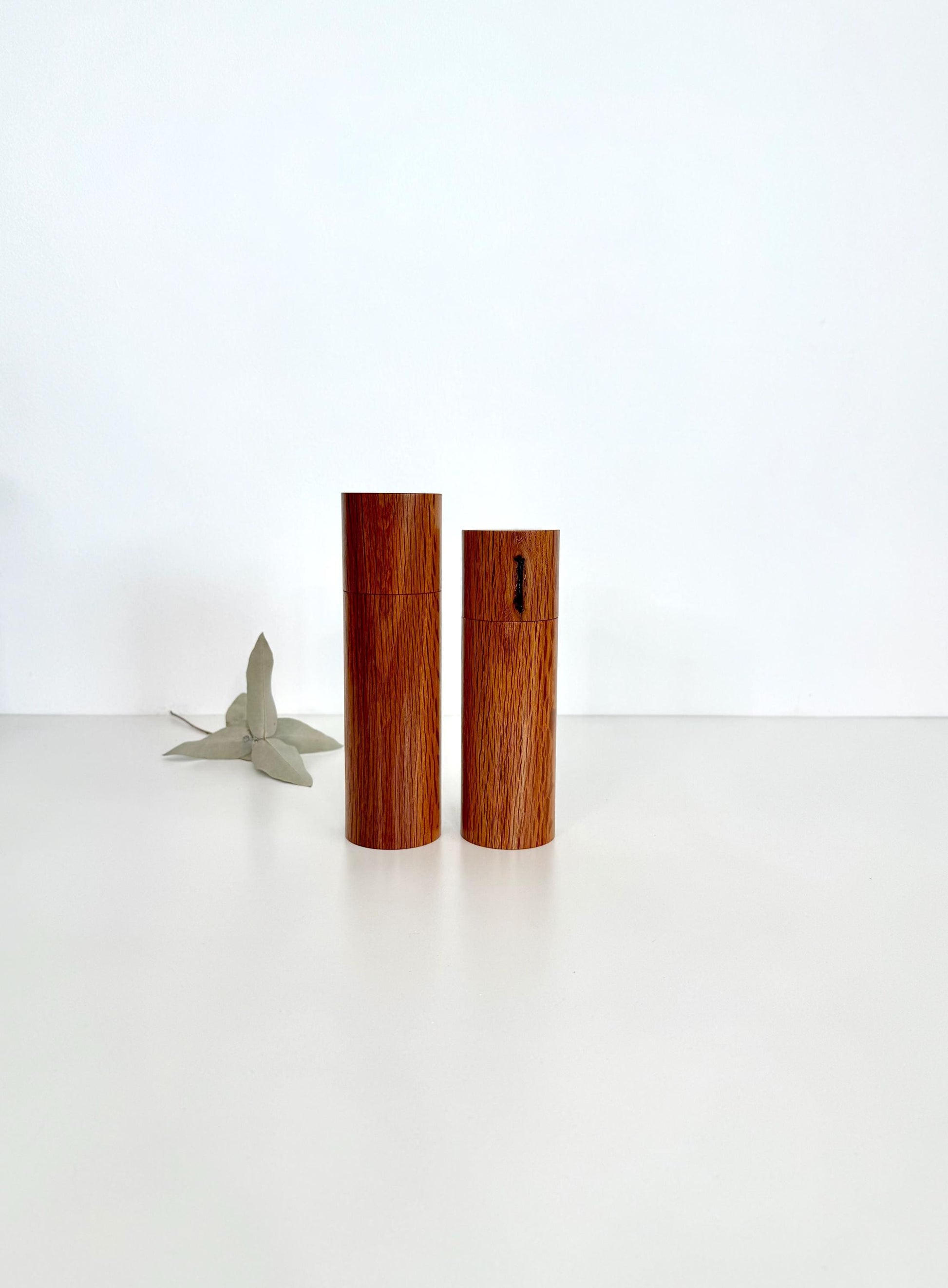 Wooden cylindrical shape salt and pepper grinders made from Sheoak timber