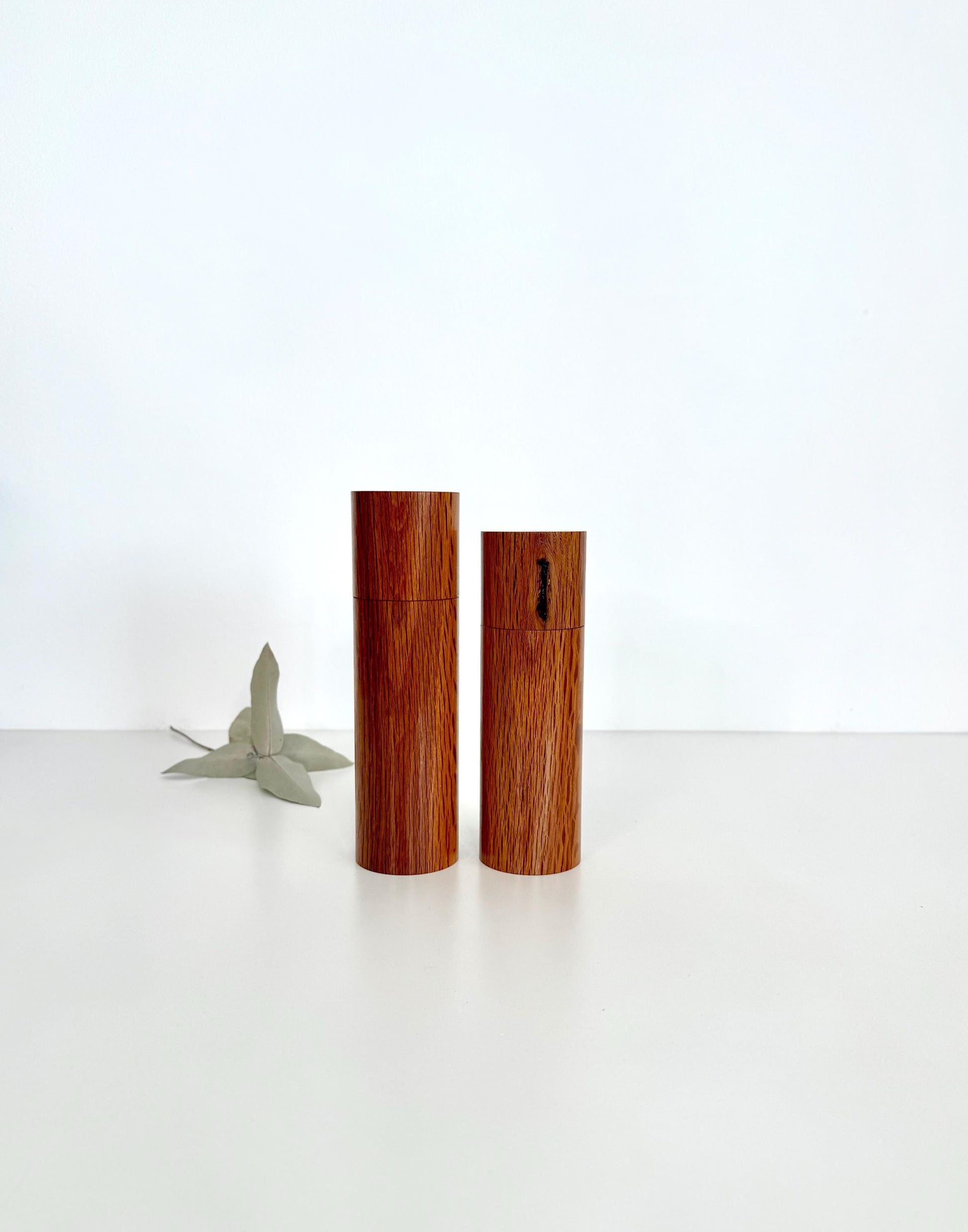 Wooden cylindrical shape salt and pepper grinders made from Sheoak timber