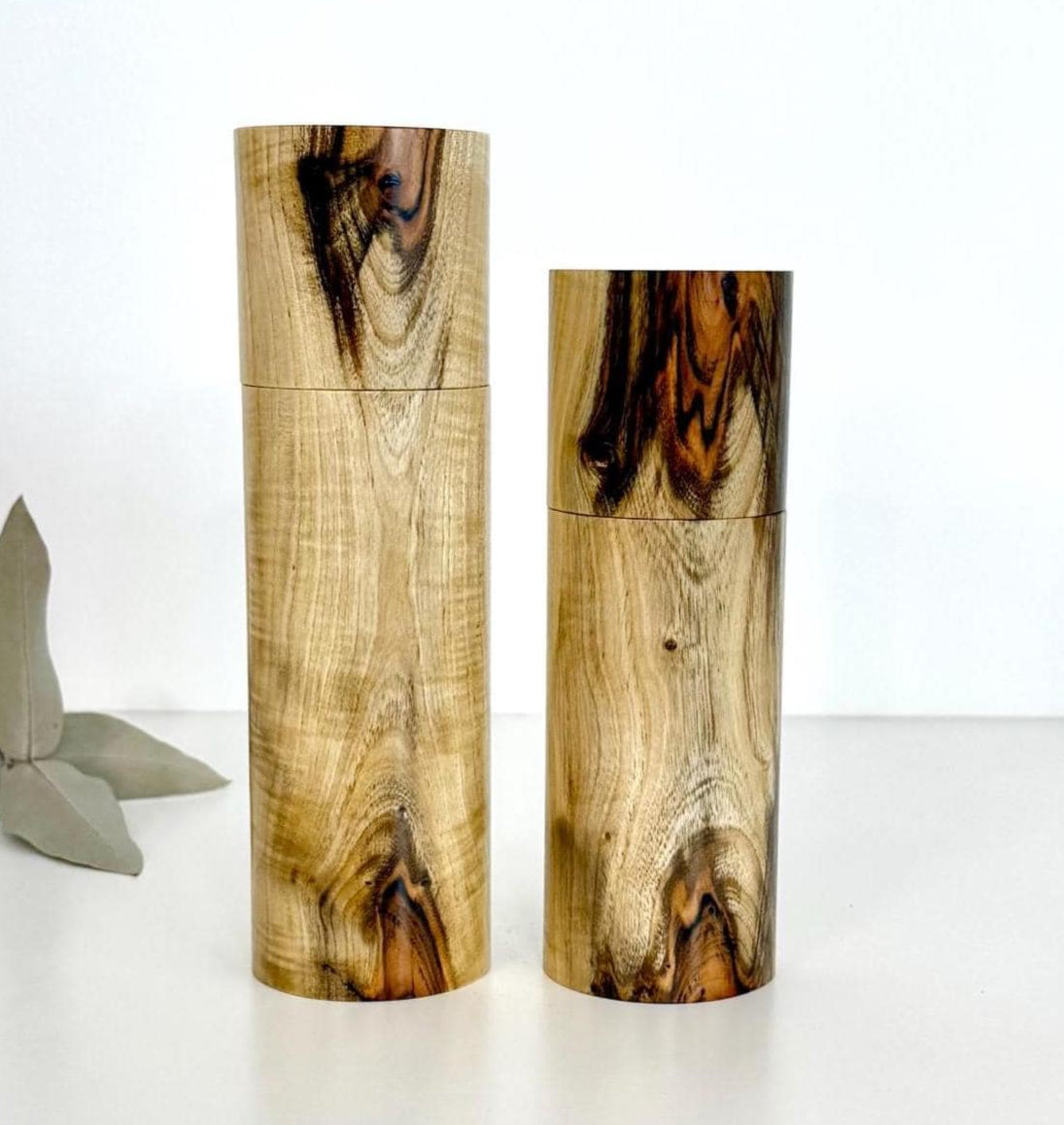 Wooden cylindrical shape salt and pepper grinders made from Pistachio timber