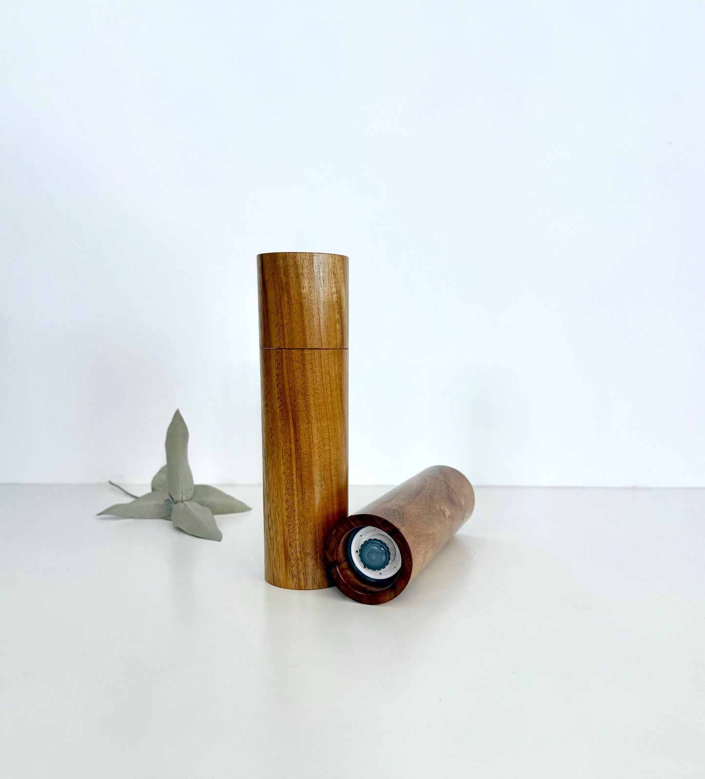 Bottom of salt and pepper grinder showing Crushgrind ceramic grinding mechanism and the adjustment knob
