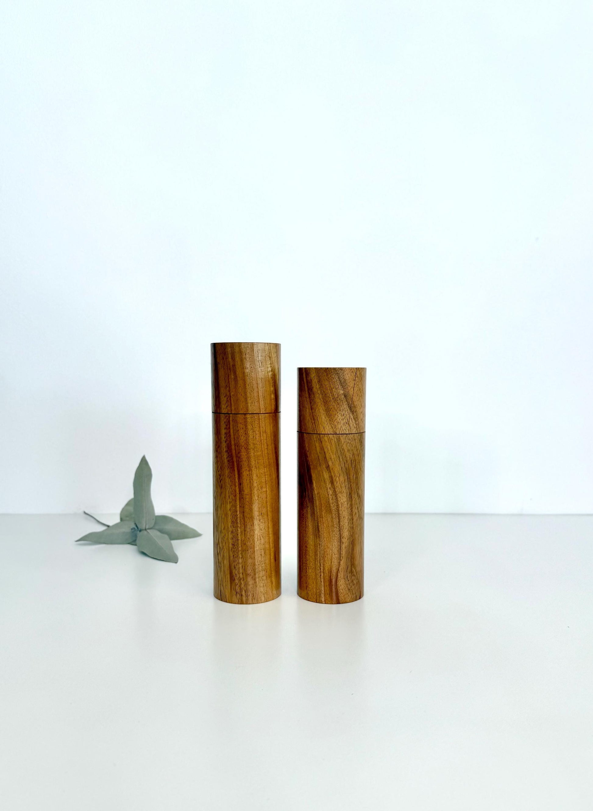 Wooden cylindrical shape salt and pepper grinders made from Black wattle timber