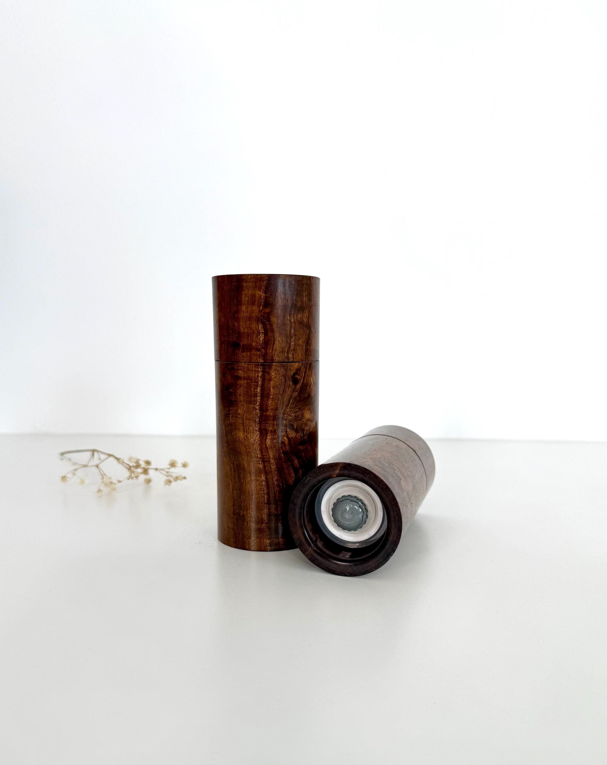 Bottom of salt and pepper grinder showing Crushgrind ceramic grinding mechanism and the adjustment knob