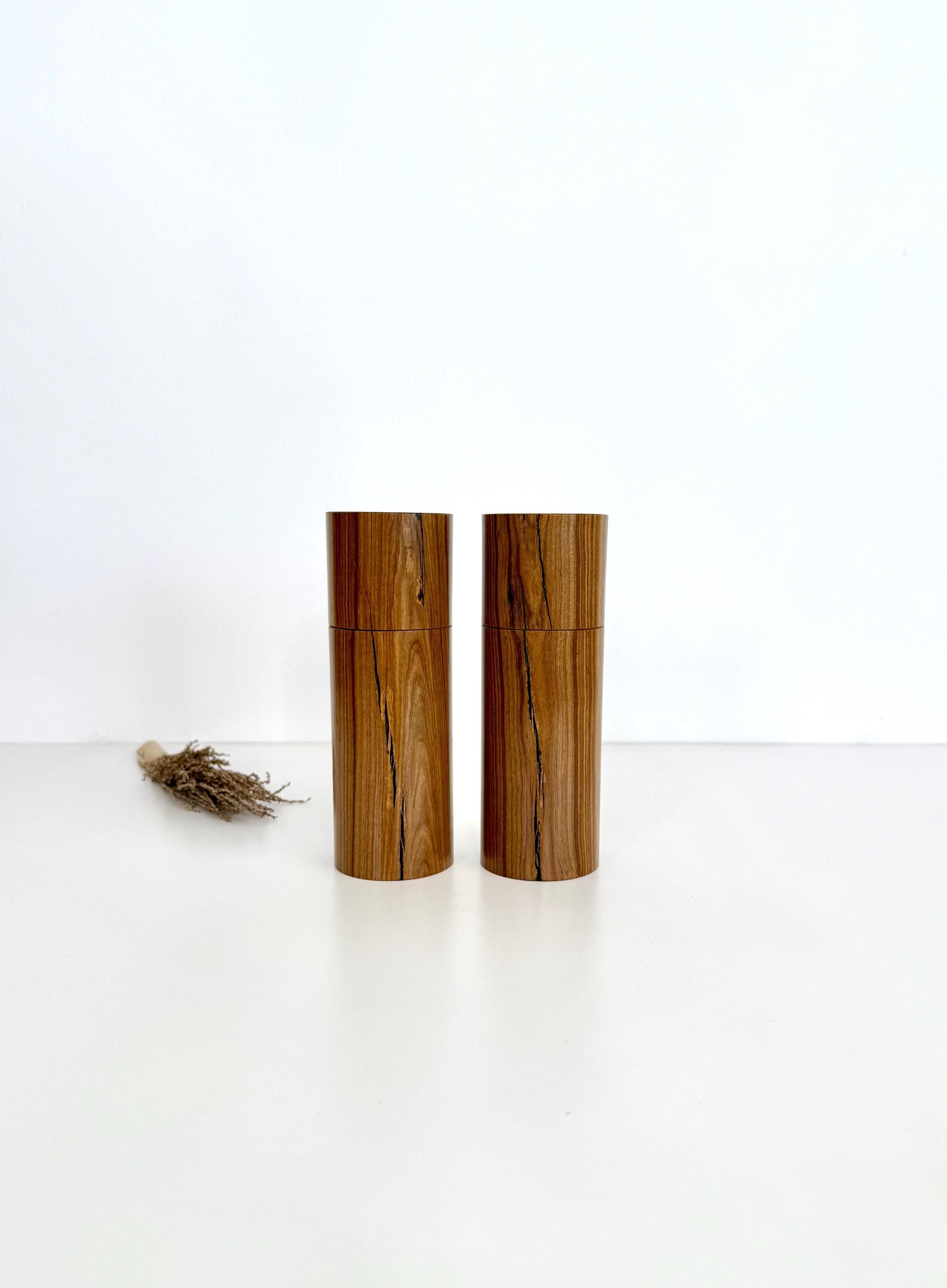 Wooden cylindrical shape salt and pepper grinders made from Rosewood timber