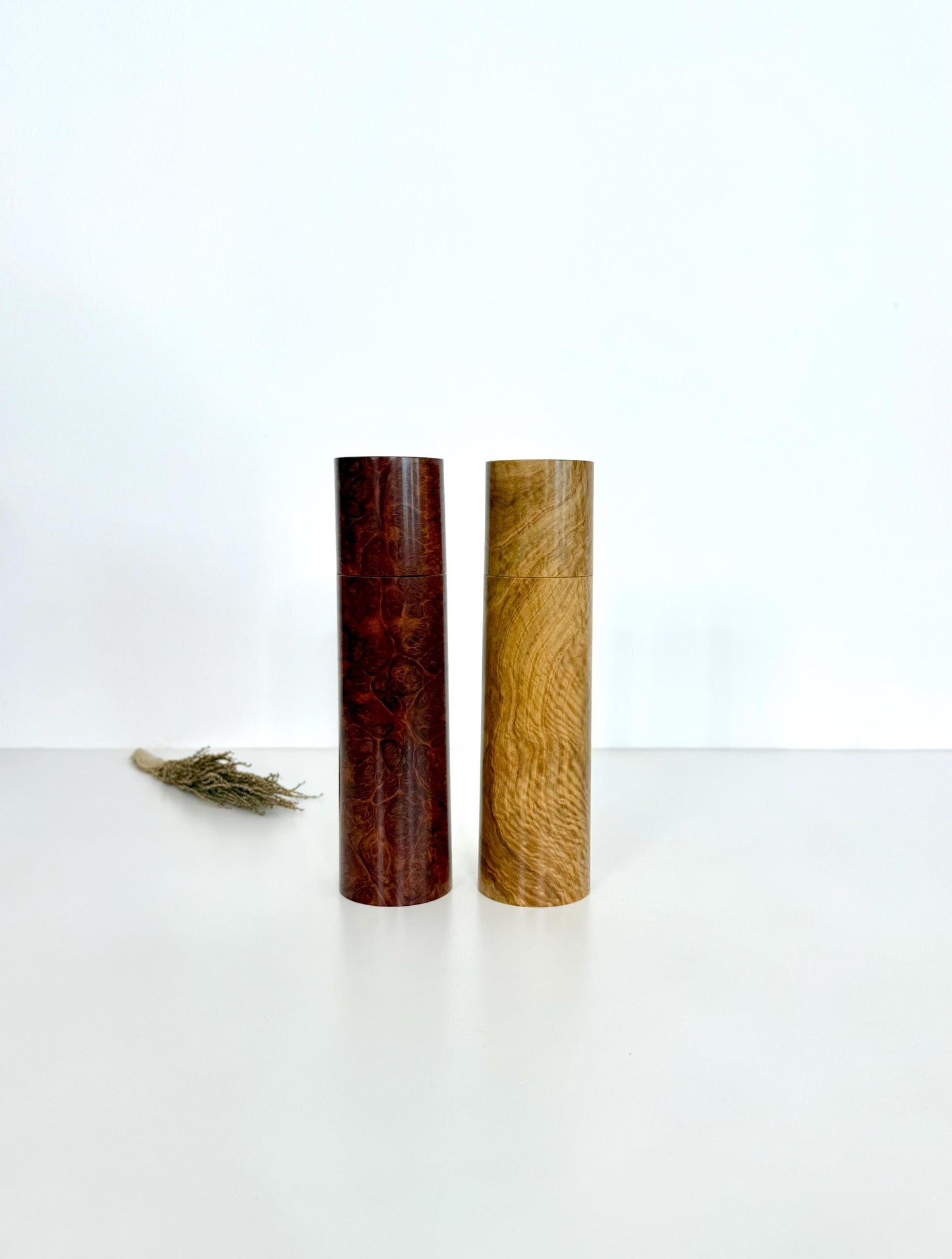 Wooden cylindrical shape salt and pepper grinders made from Red Mallee burl and Bimble Box burl timbers