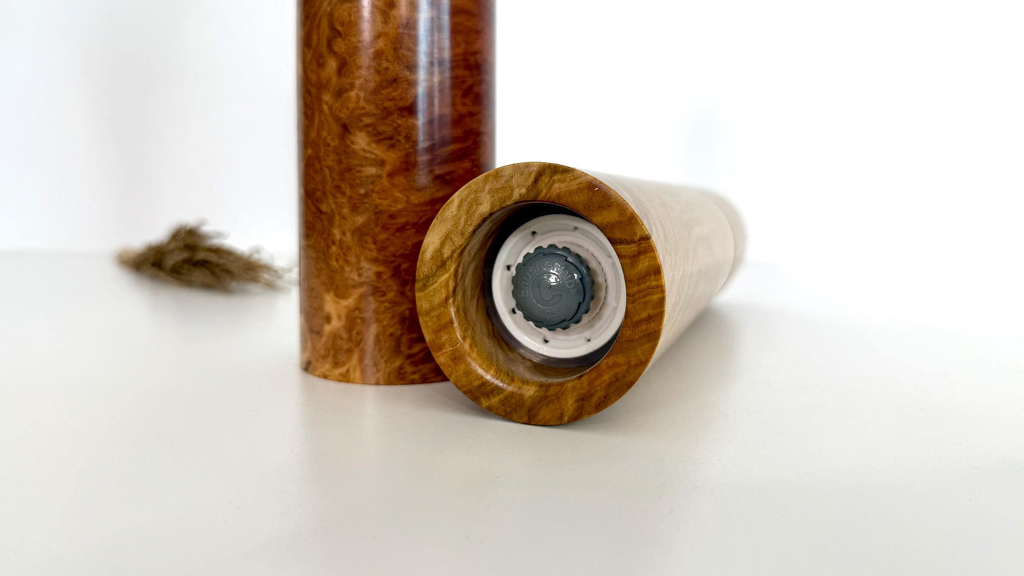 Bottom of salt and pepper grinder showing Crushgrind ceramic grinding mechanism and the adjustment knob