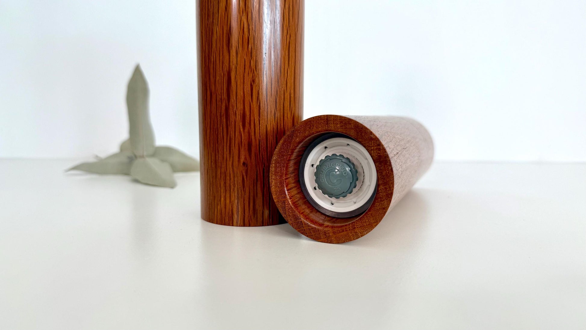 Bottom of salt and pepper grinder showing Crushgrind ceramic grinding mechanism and the adjustment knob