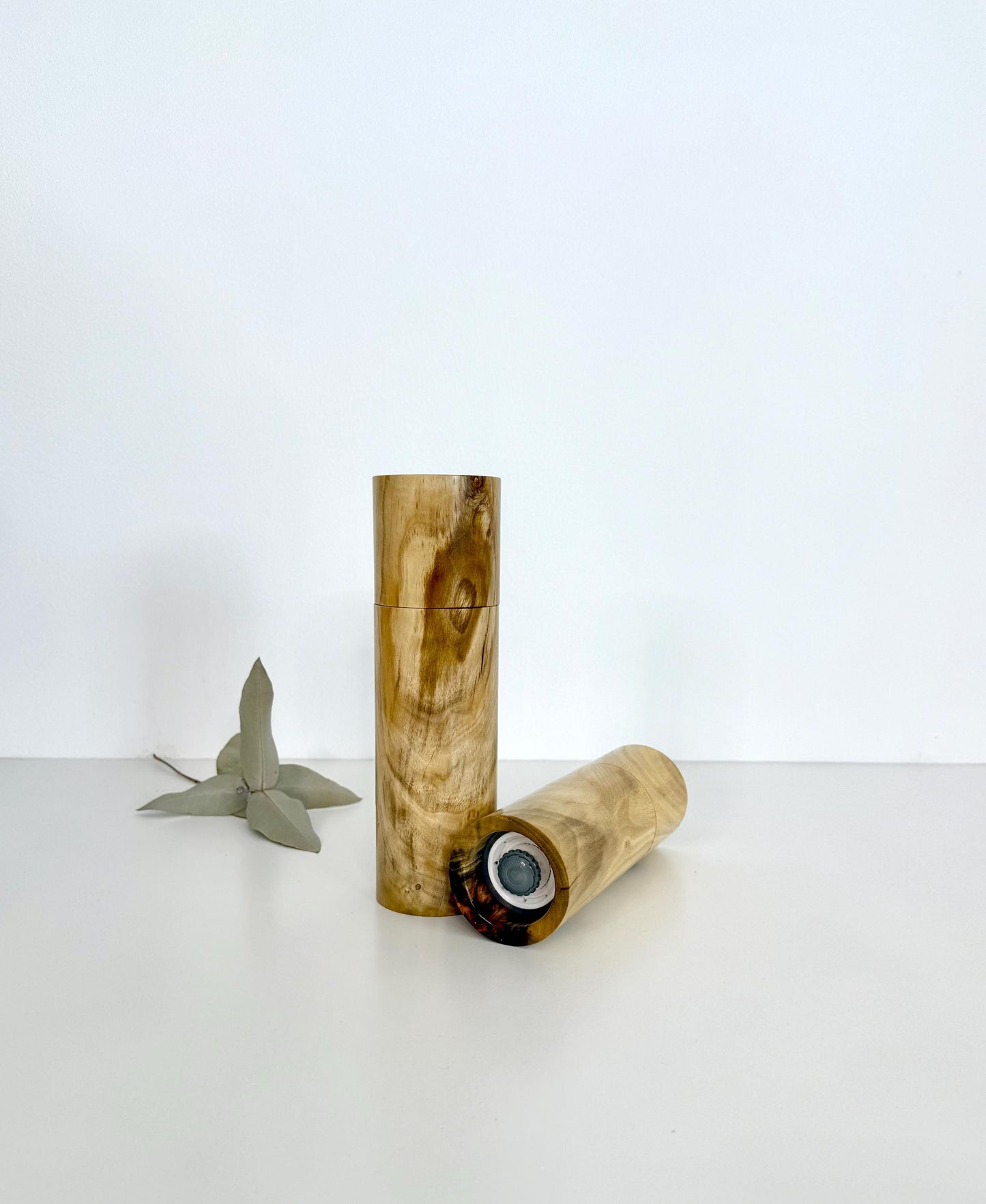 Bottom of salt and pepper grinder showing Crushgrind ceramic grinding mechanism and the adjustment knob