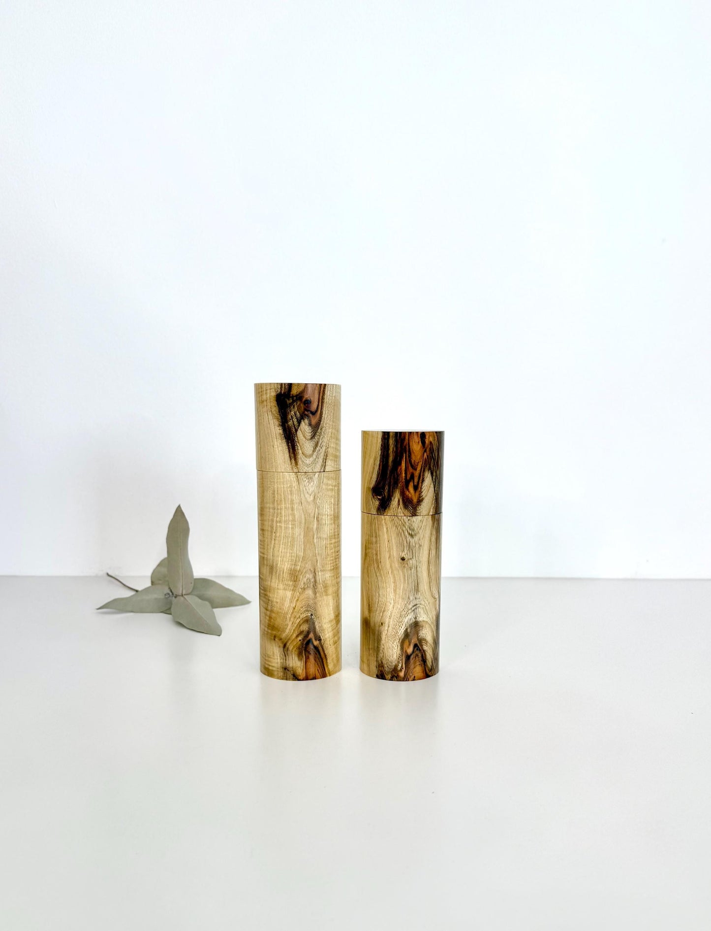Wooden cylindrical shape salt and pepper grinders made from Pistachio timber