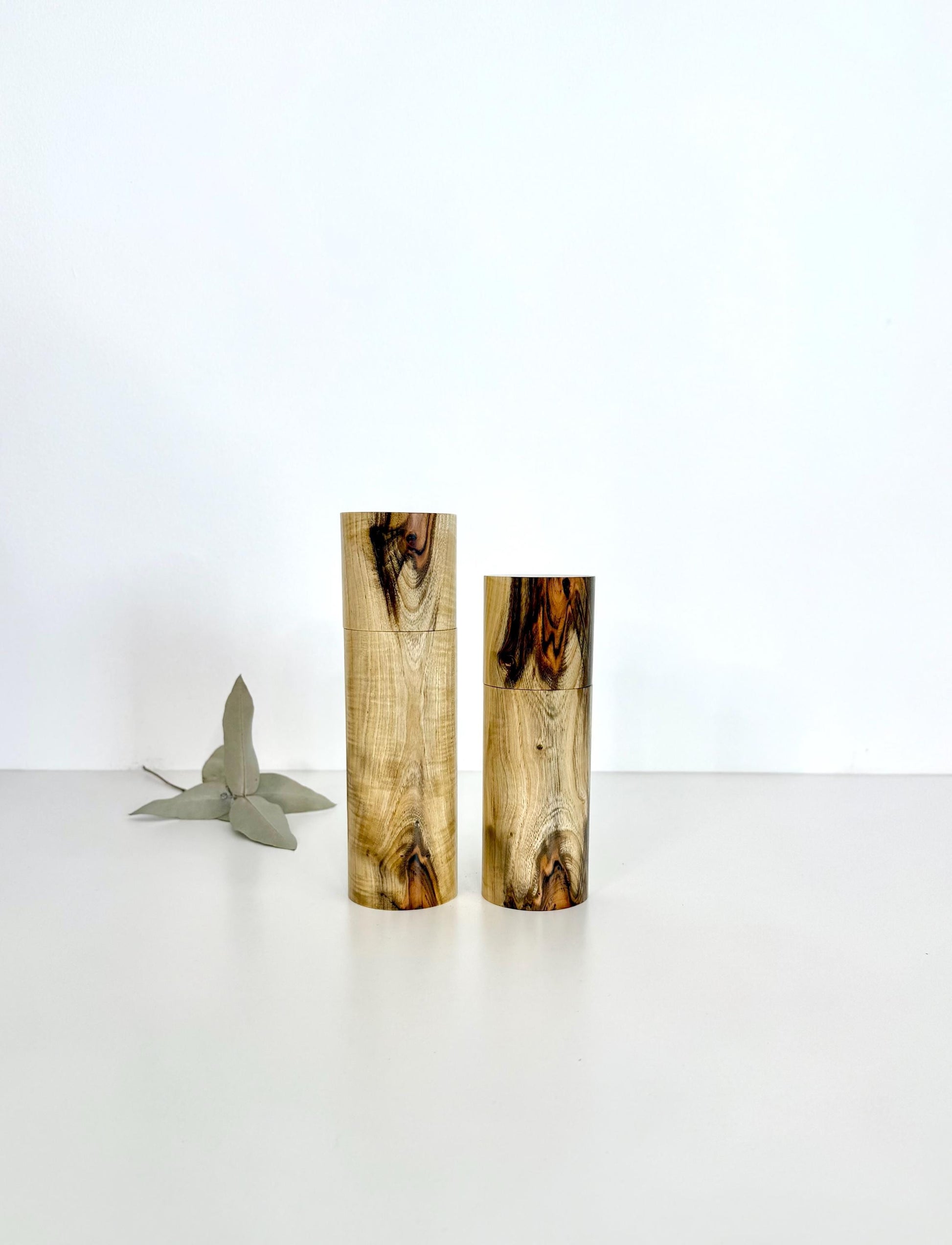 Wooden cylindrical shape salt and pepper grinders made from Pistachio timber