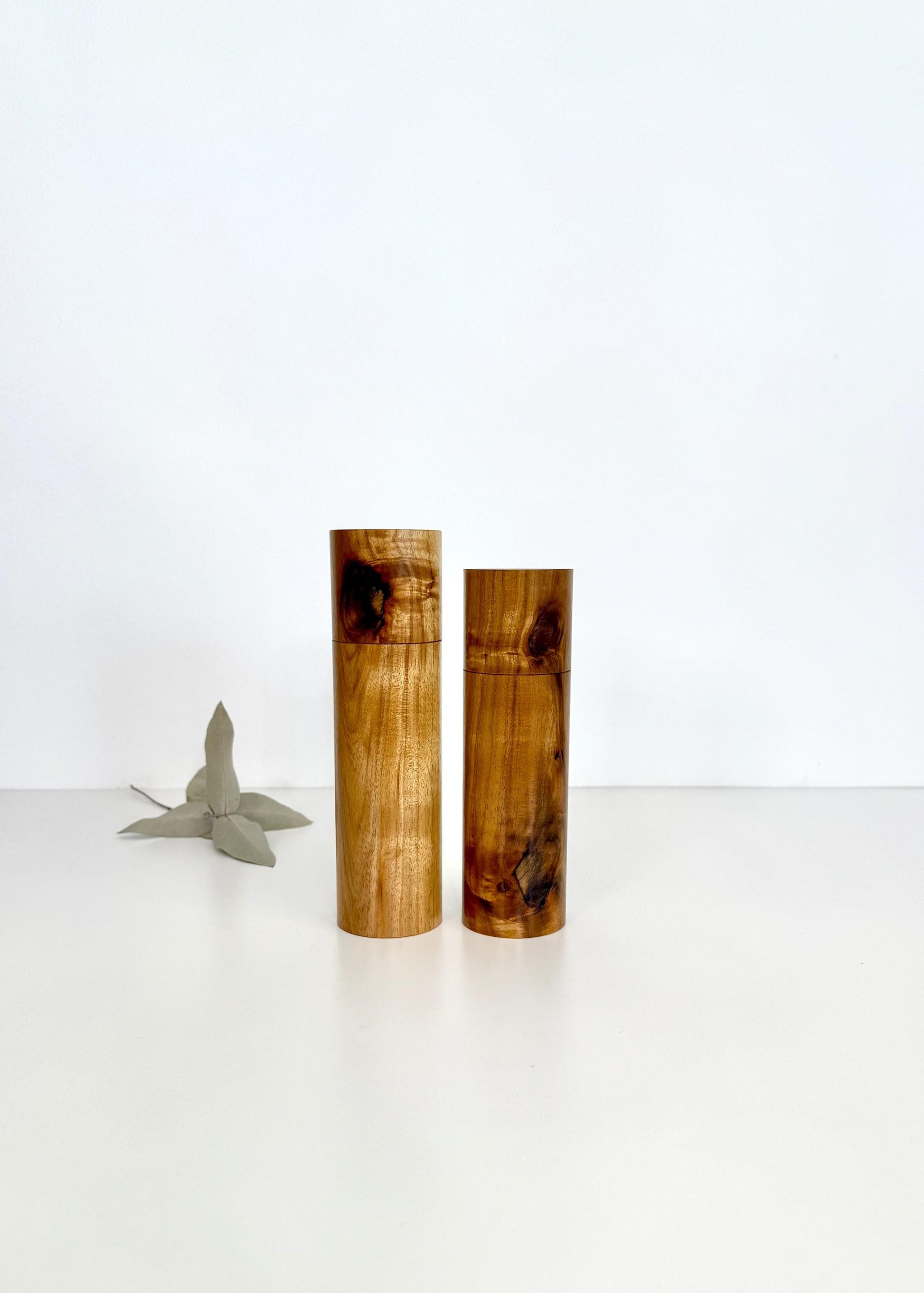 Wooden cylindrical shape salt and pepper grinders made from Black wattle timber