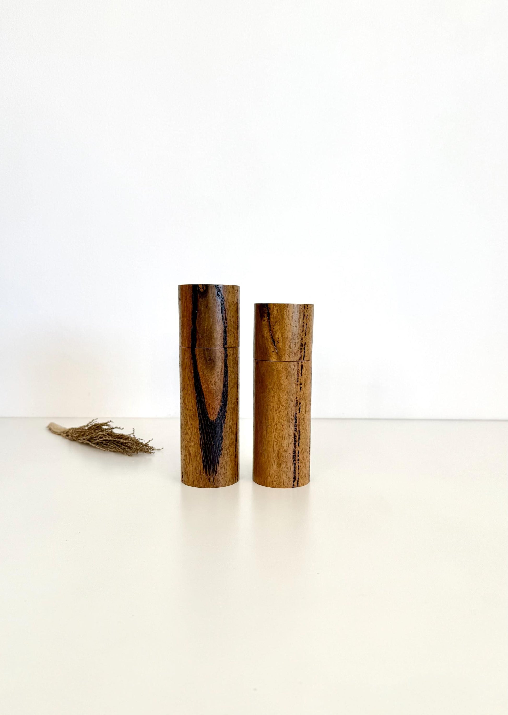 Wooden cylindrical shape salt and pepper grinders made from Marri timber