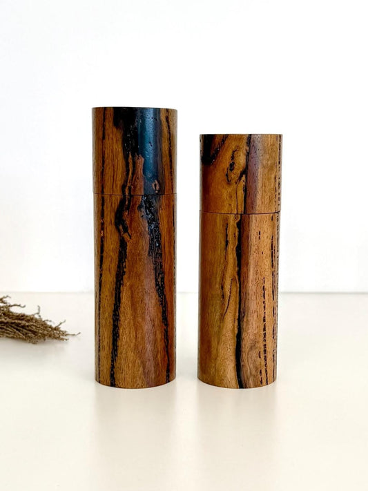 Wooden cylindrical shape salt and pepper grinders made from Marri timber