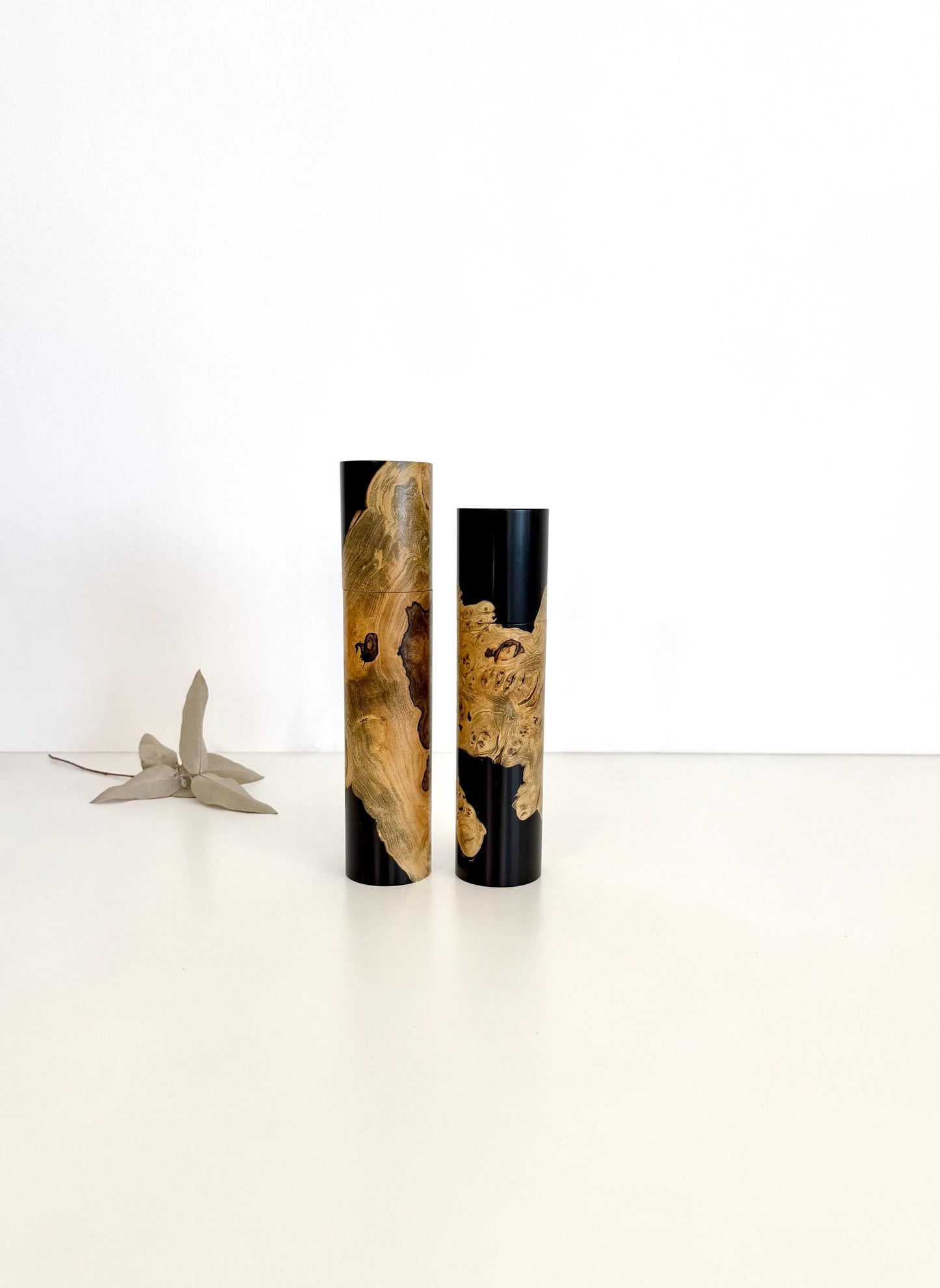 Wooden cylindrical shape salt and pepper grinders made from Wilga burl timber
