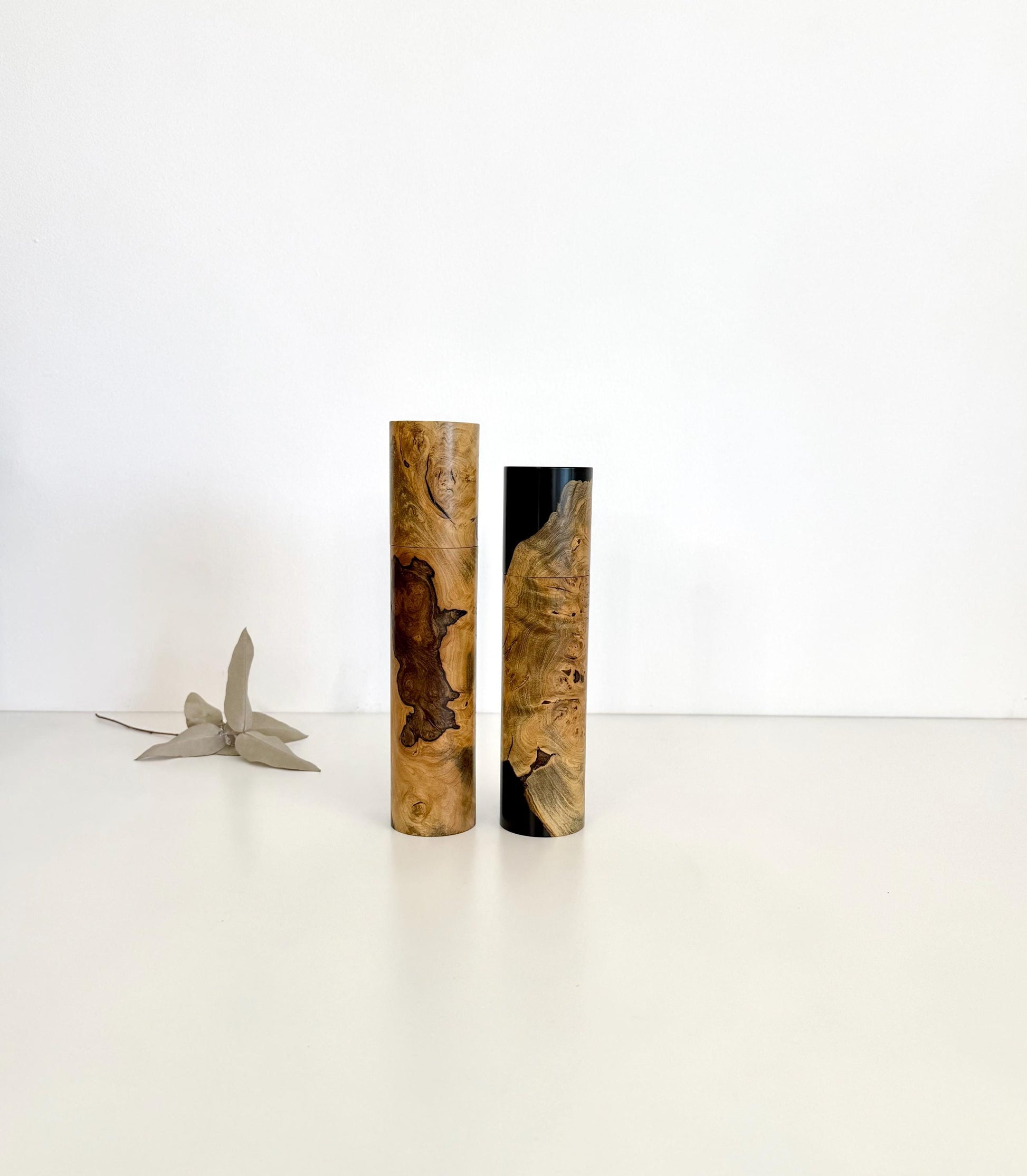 Wooden cylindrical shape salt and pepper grinders made from Wilga burl timber