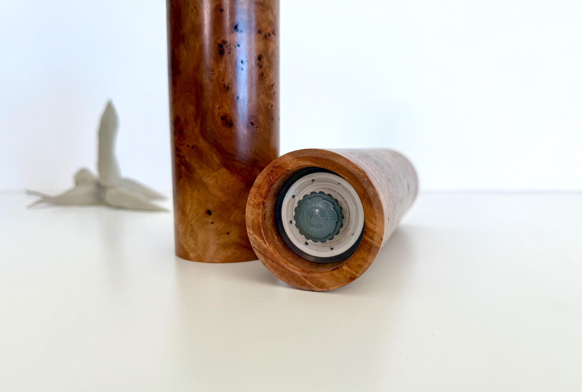 Bottom of salt and pepper grinder showing Crushgrind ceramic grinding mechanism and the adjustment knob