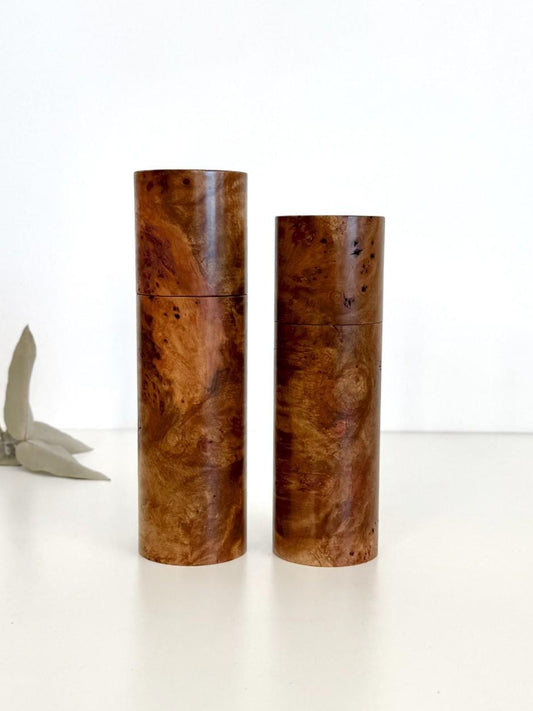 Wooden cylindrical shape salt and pepper grinders made from Mrytle burl timber