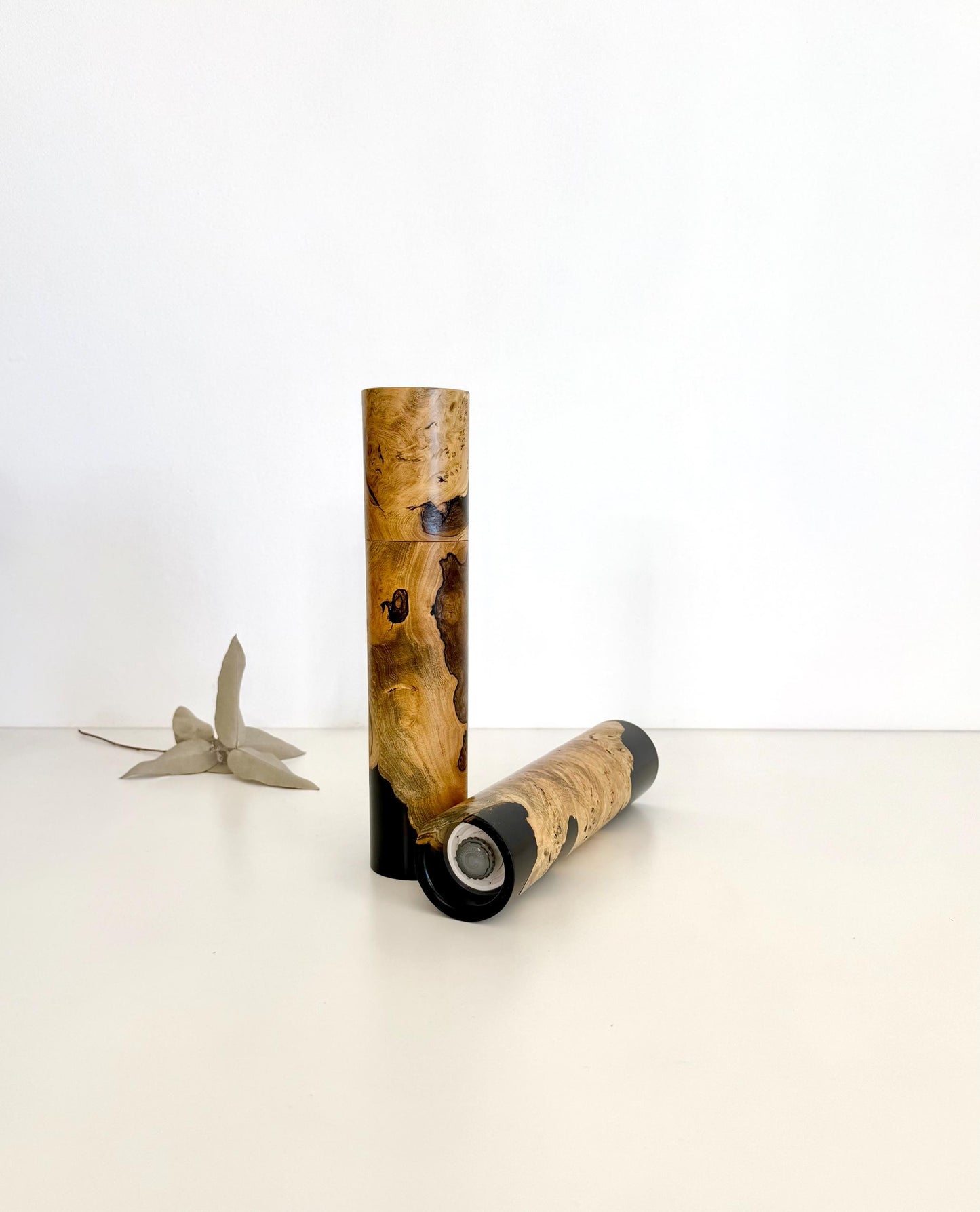 Bottom of salt and pepper grinder showing Crushgrind ceramic grinding mechanism and the adjustment knob