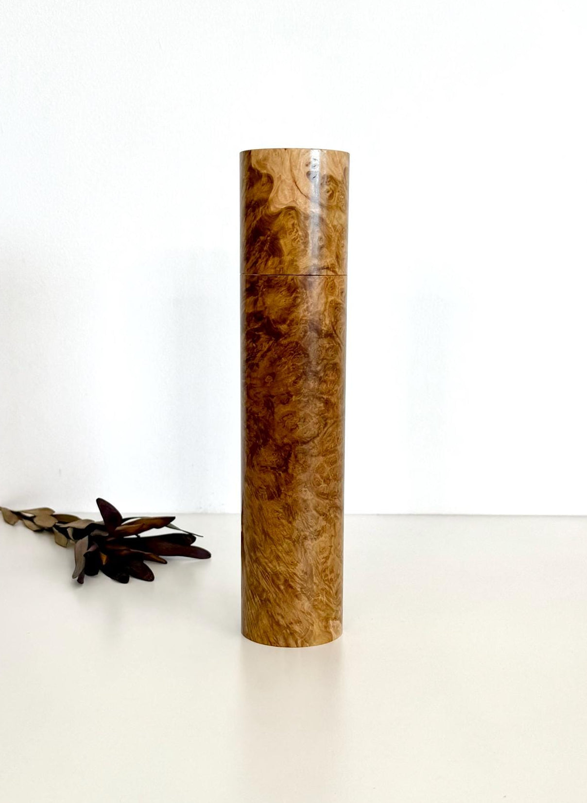 Wooden cylindrical shape salt and pepper grinder made from York gum burl timber