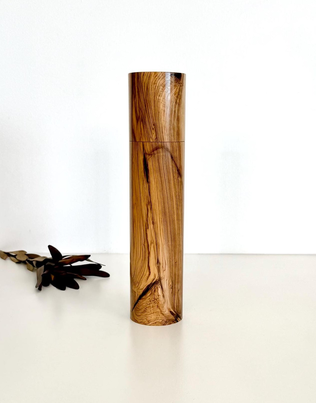 Wooden cylindrical shape salt and pepper grinder made from Olive timber