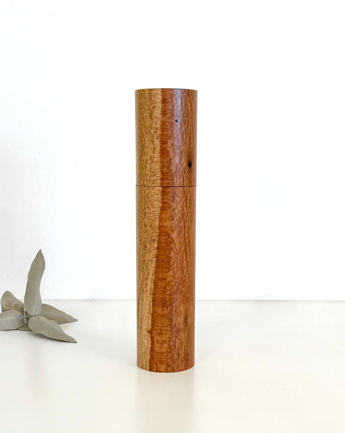 Wooden cylindrical shape salt and pepper grinder made from Snotty gobble timber