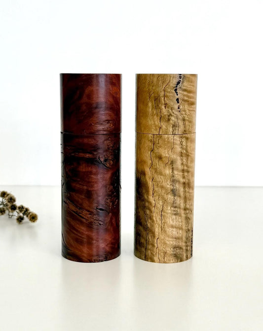 Wooden cylindrical shape salt and pepper grinders made from Marri and Jarrah burl timbers
