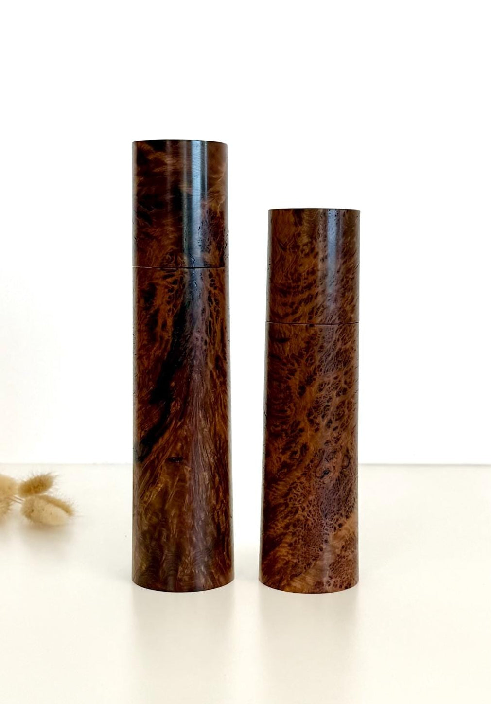 Wooden cylindrical shape salt and pepper grinders made from Gimlet Burl timber
