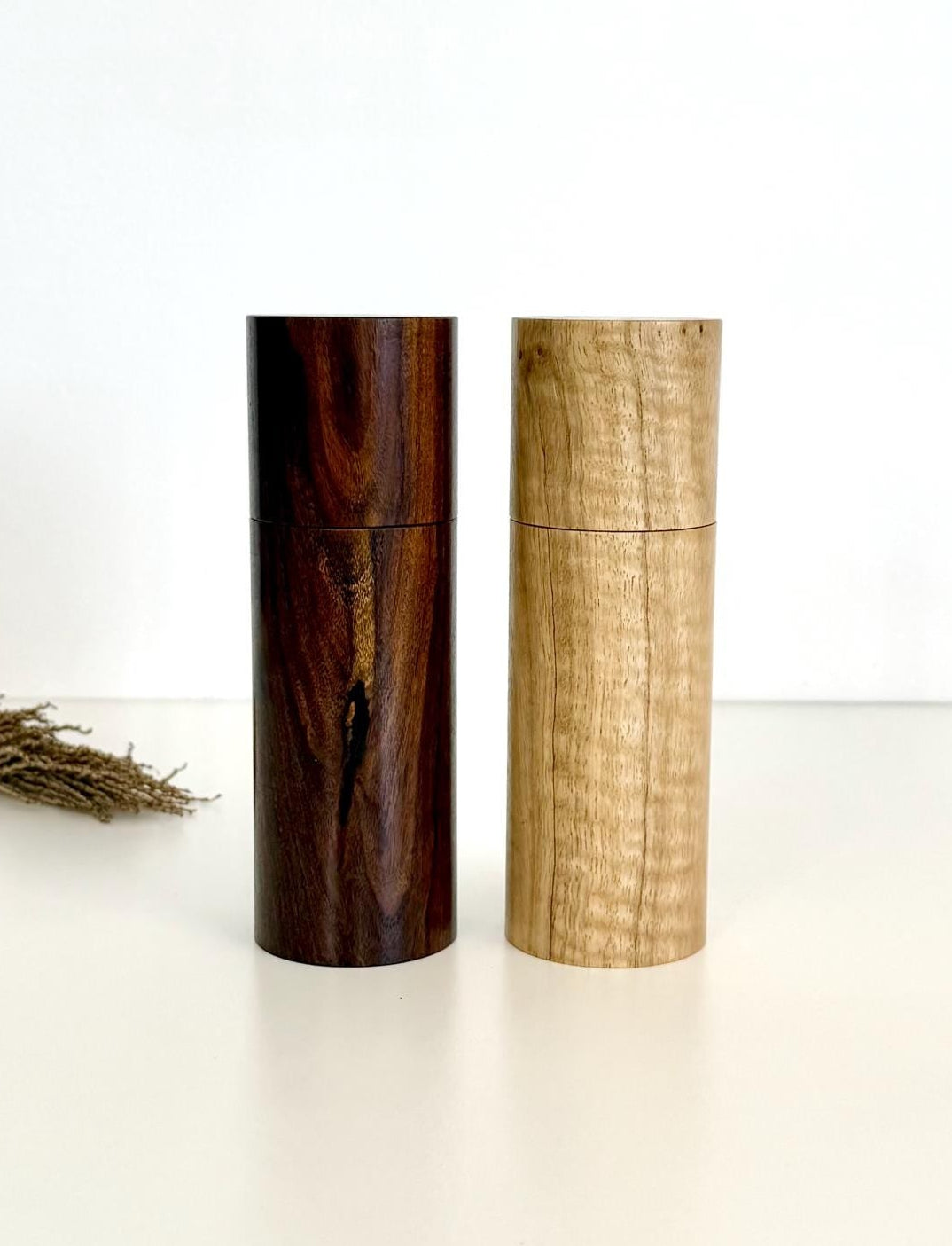 Wooden cylindrical shape salt and pepper grinders made from Marri and Mulga timbers