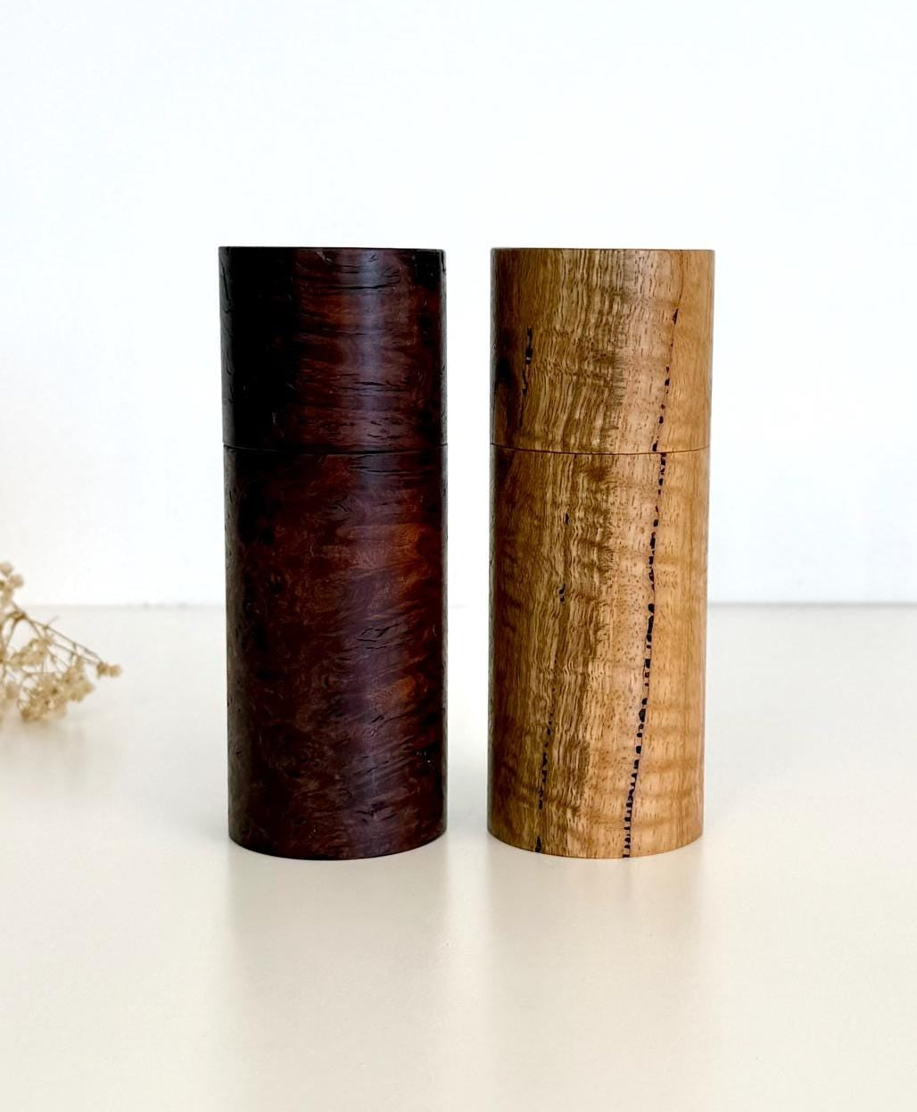 Wooden cylindrical shape salt and pepper grinders made from Jarrah burl and Marri timbers