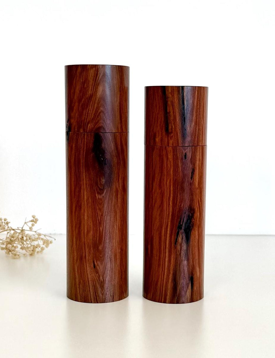 Wooden cylindrical shape salt and pepper grinders made from Mallee timber