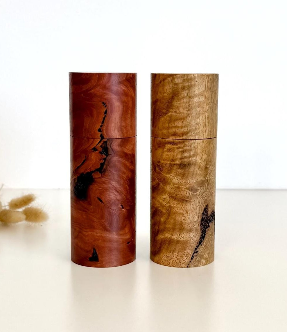 Wooden cylindrical shape salt and pepper grinders made from Salmon gum burl and Marri timbers