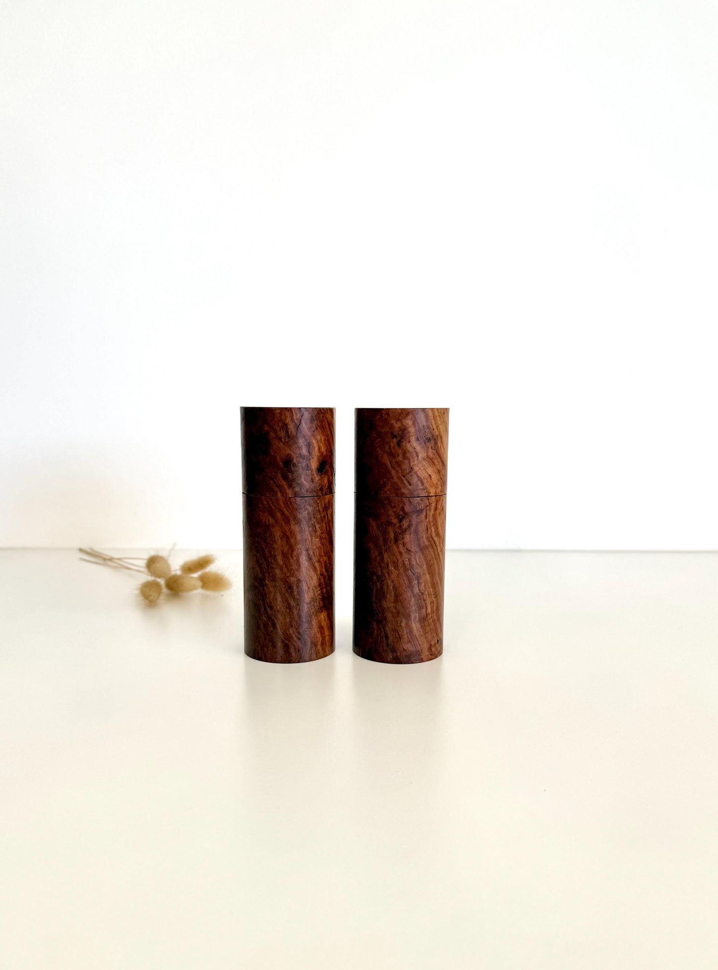 Wooden cylindrical shape salt and pepper grinders made from Gimlet timber