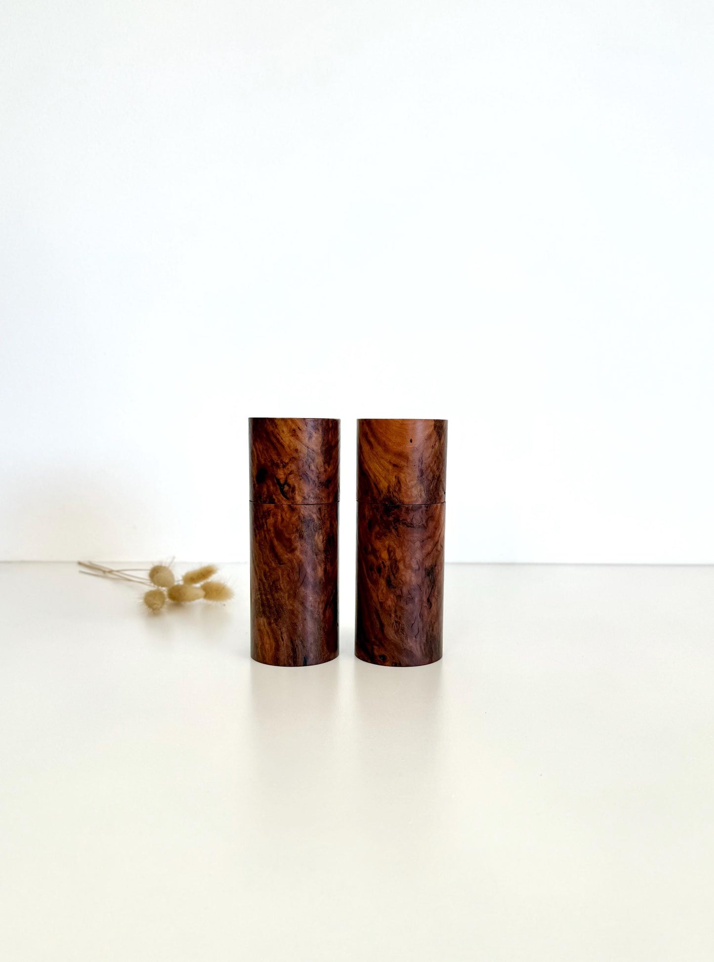 Wooden cylindrical shape salt and pepper grinders made from Gimlet timber