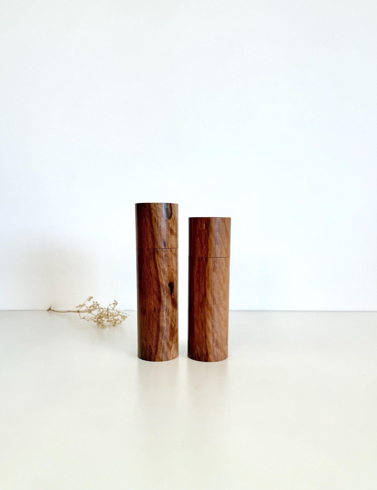 Wooden cylindrical shape salt and pepper grinders made from Mallee timber