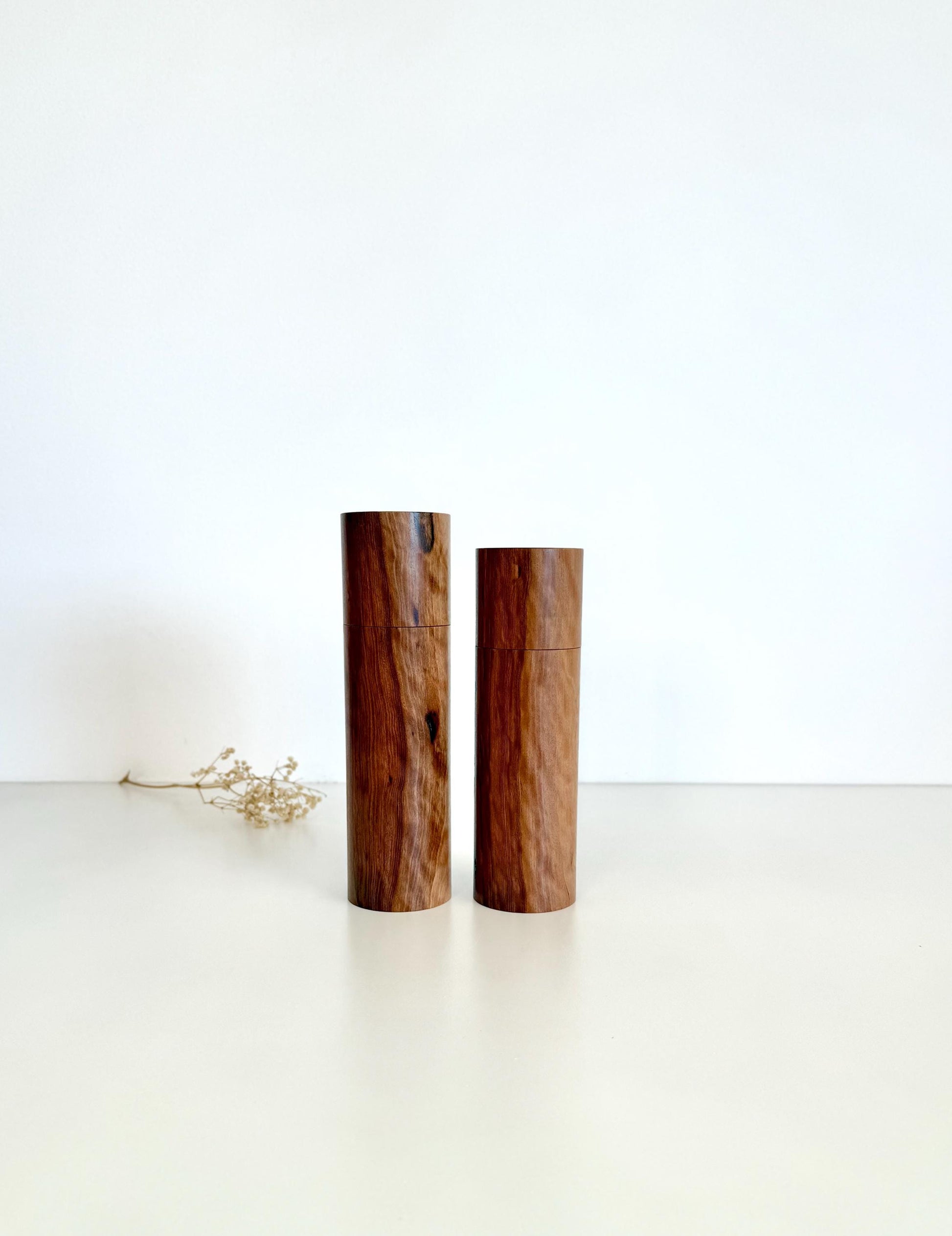 Wooden cylindrical shape salt and pepper grinders made from Mallee timber