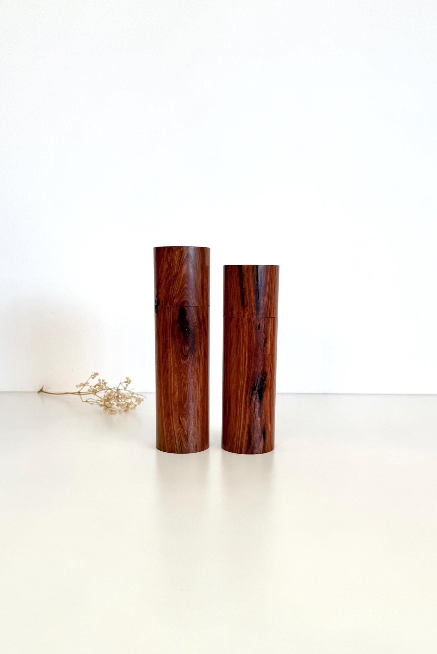 Wooden cylindrical shape salt and pepper grinders made from Mallee timber