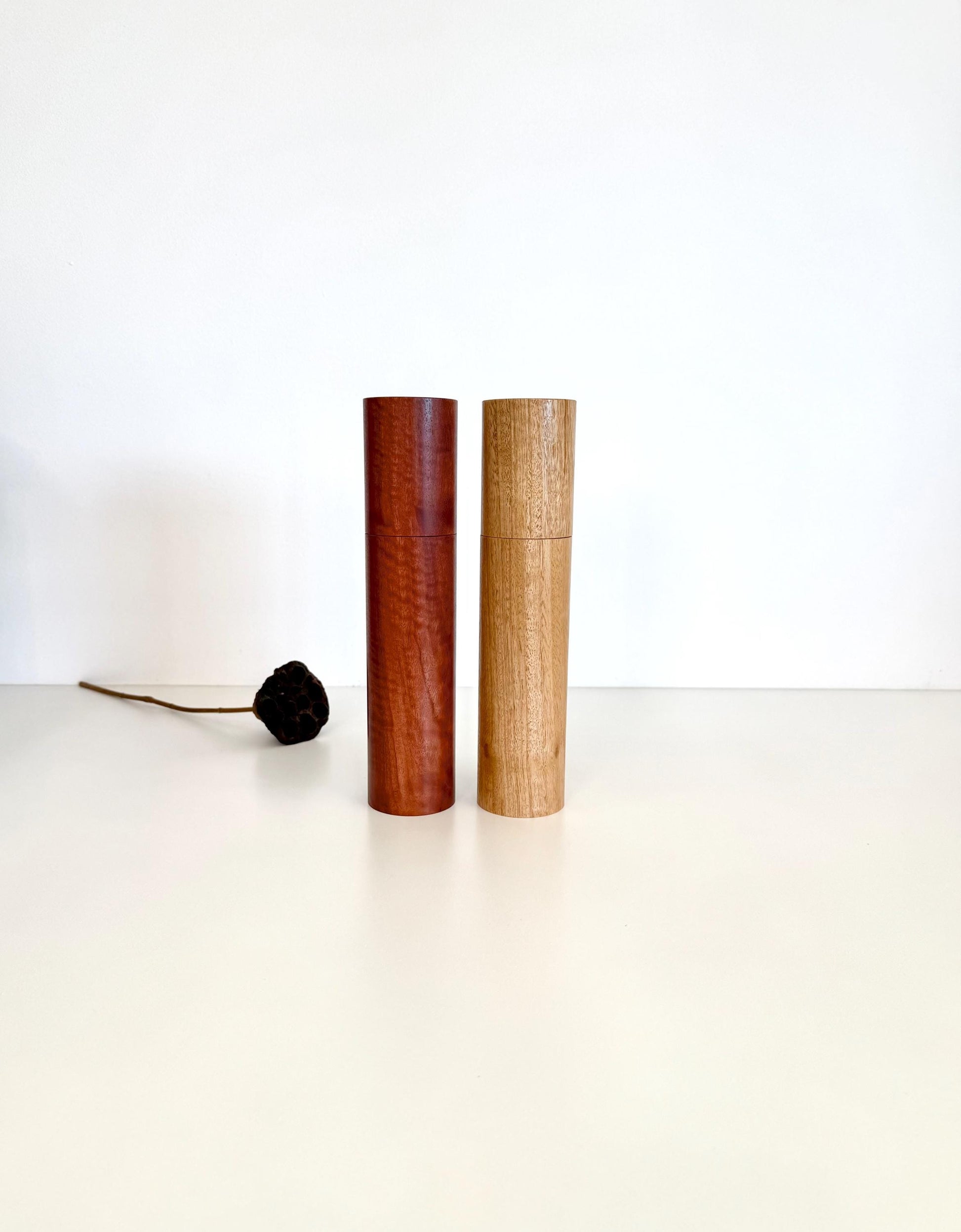 Wooden cylindrical shape salt and pepper grinders made from Jarrah and Blackbutt timbers