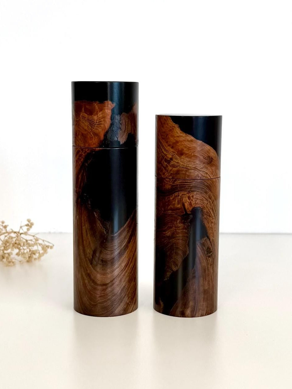 Wooden cylindrical shape salt and pepper grinders made from Dundas Blackbutt and black resin