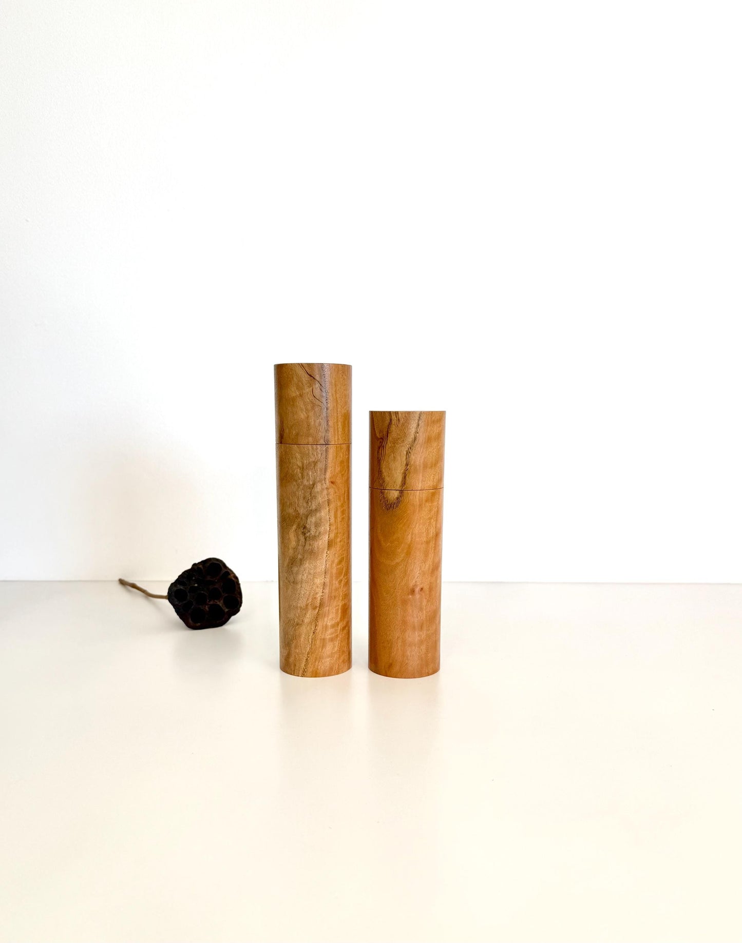 Wooden cylindrical shape salt and pepper grinders made from blackbutt timber