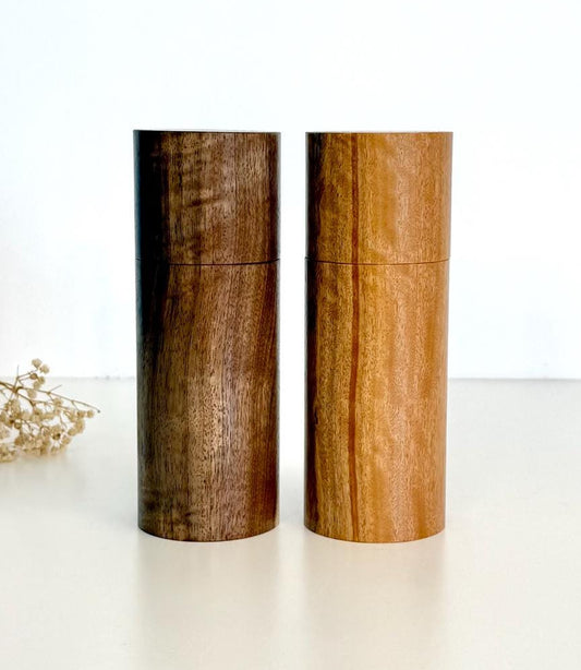 Wooden cylindrical shape salt and pepper grinders made from Blackbutt and Walnut timbers